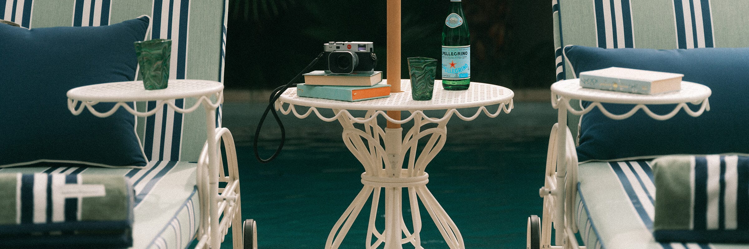 yellow patio umbrella tops poolside