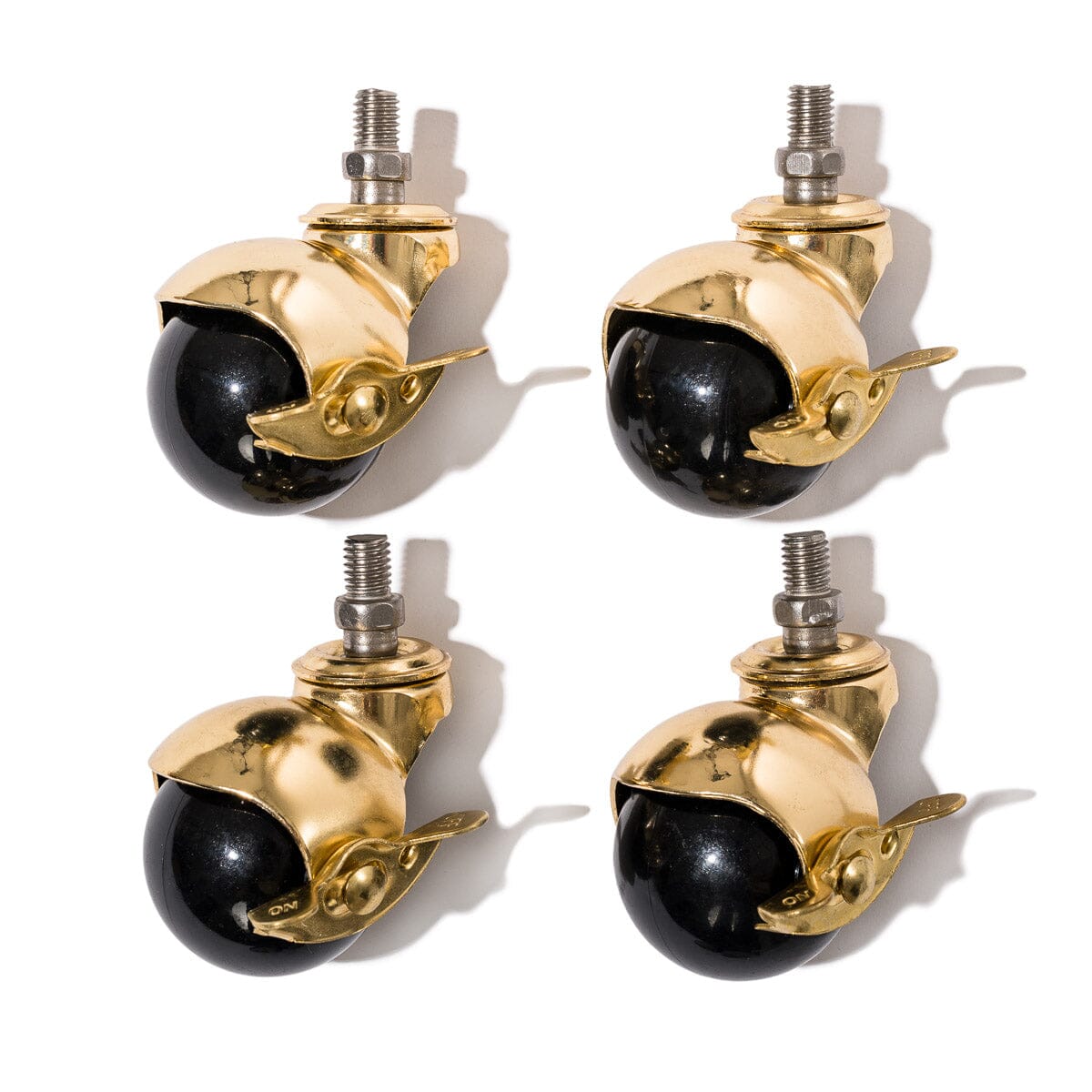 Product image of The Umbrella Base - Ball Caster Wheels - Gold/Black - Set Of 4 Umbrella Base Ball Caster Wheels Business & Pleasure Co.