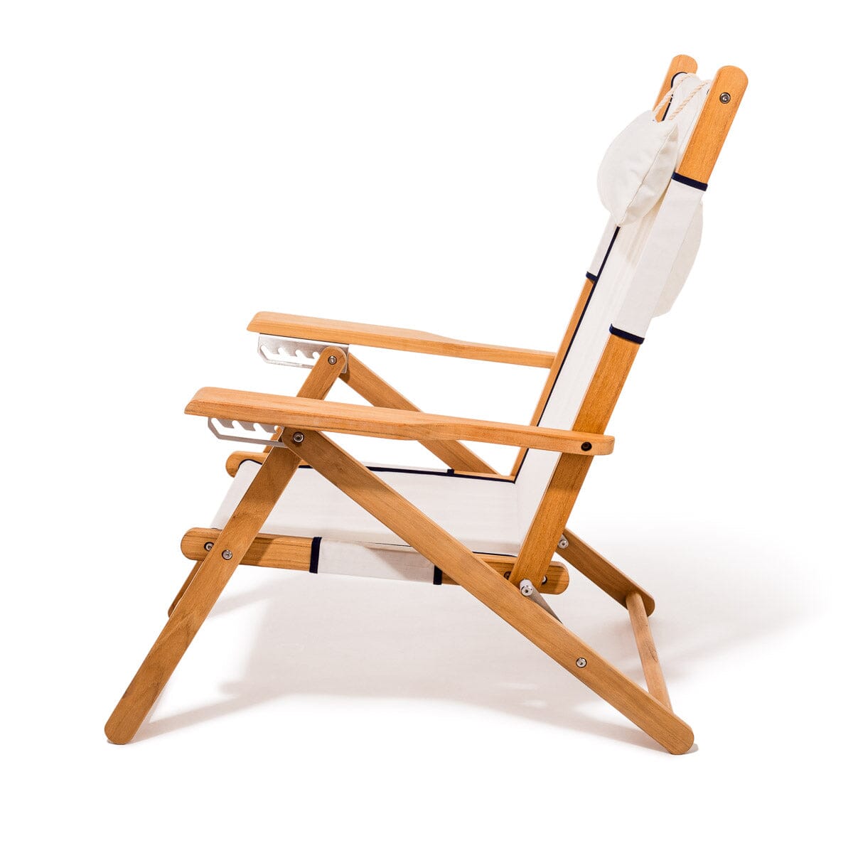 Wooden deck chair with white canvas seat and backrest with navy blue piping