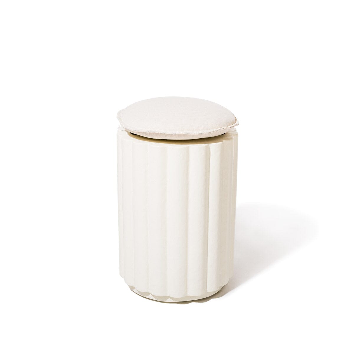White cylindrical Side Table with a
cushion on a white background