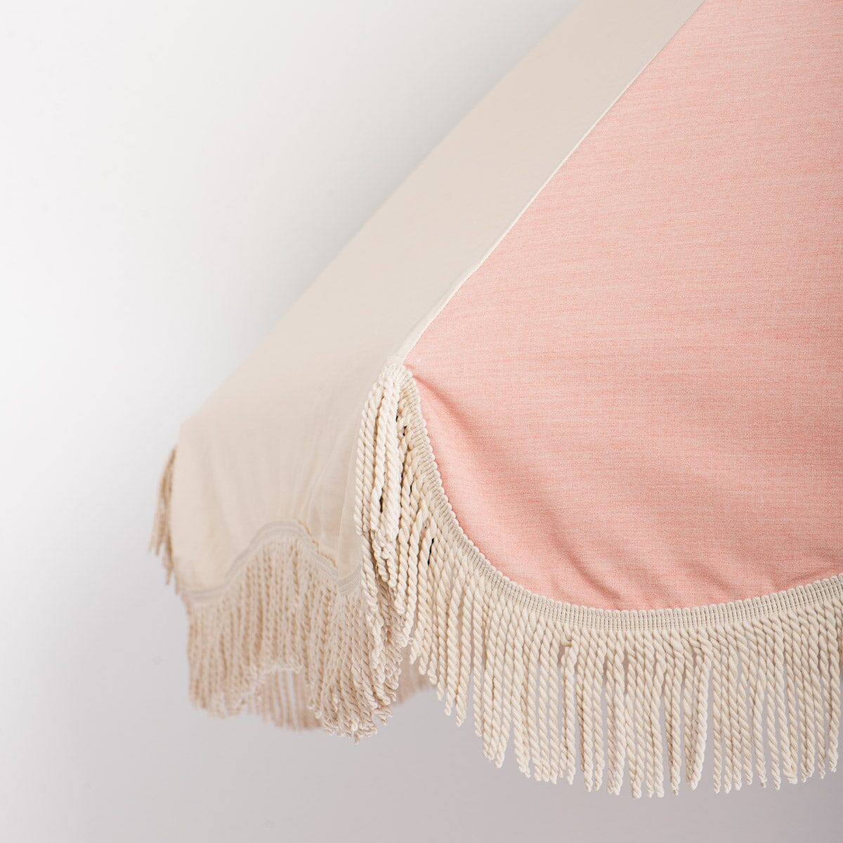 close up of canopy pink and white with fringe 