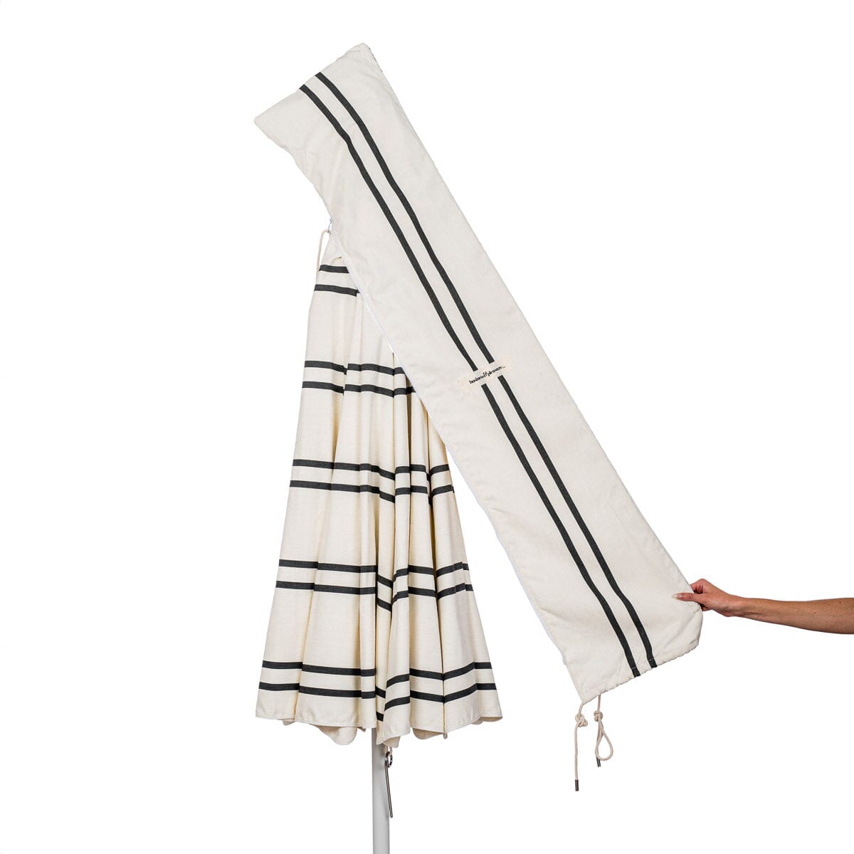 carry bag detail on black and white stripe patio umbrella