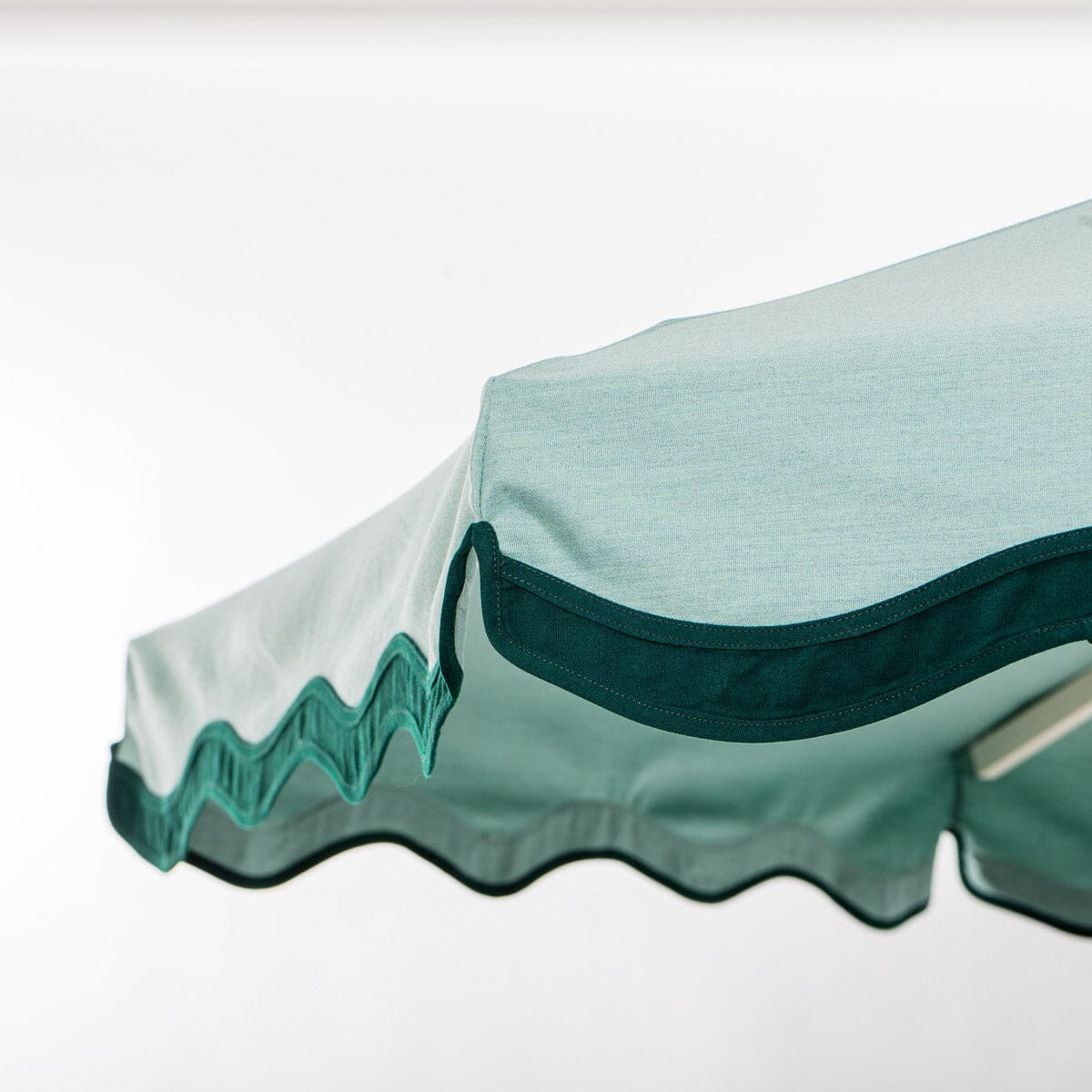 The Resort Market Umbrella in Rivie Green | 10' Antique White Frame Bundle Business & Pleasure Co.