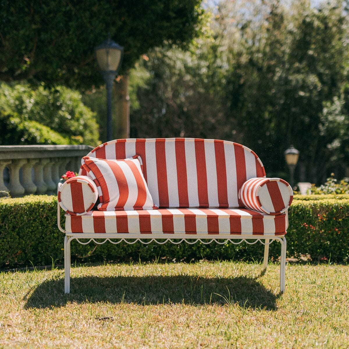 The Al Fresco Love Seat in Crew Le Sirenuse Stripe | Antique White Frame Bundle Business & Pleasure Co.