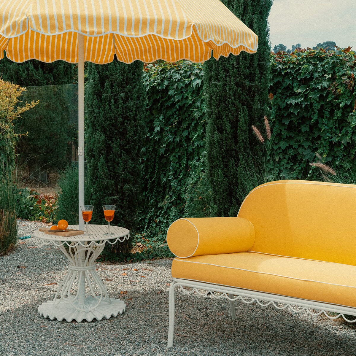 The Al Fresco Love Seat in Rivie Mimosa | Antique White Frame Bundle Business & Pleasure Co.