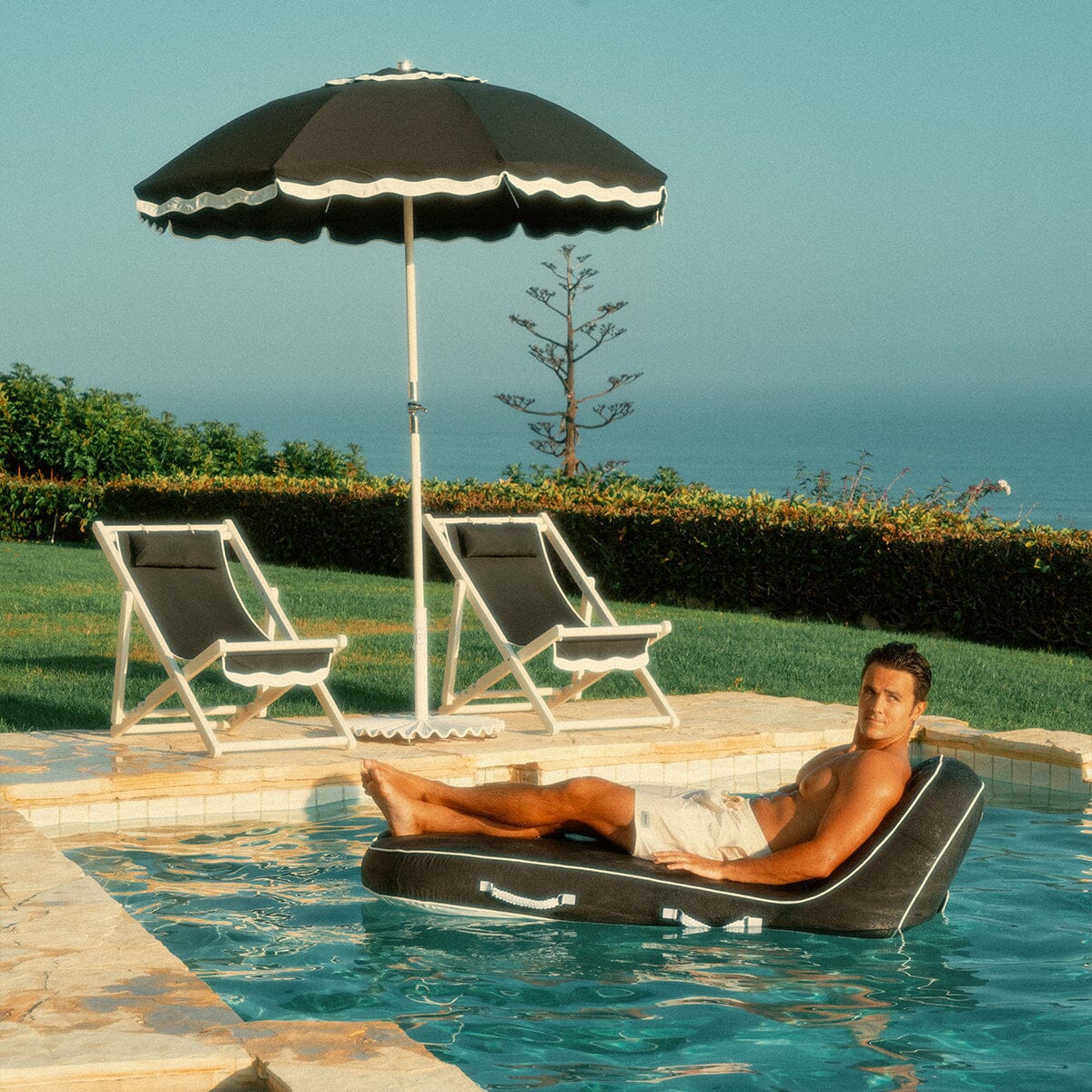 The Pool Lounger - Rivie Black Pool Lounger Business & Pleasure Co.