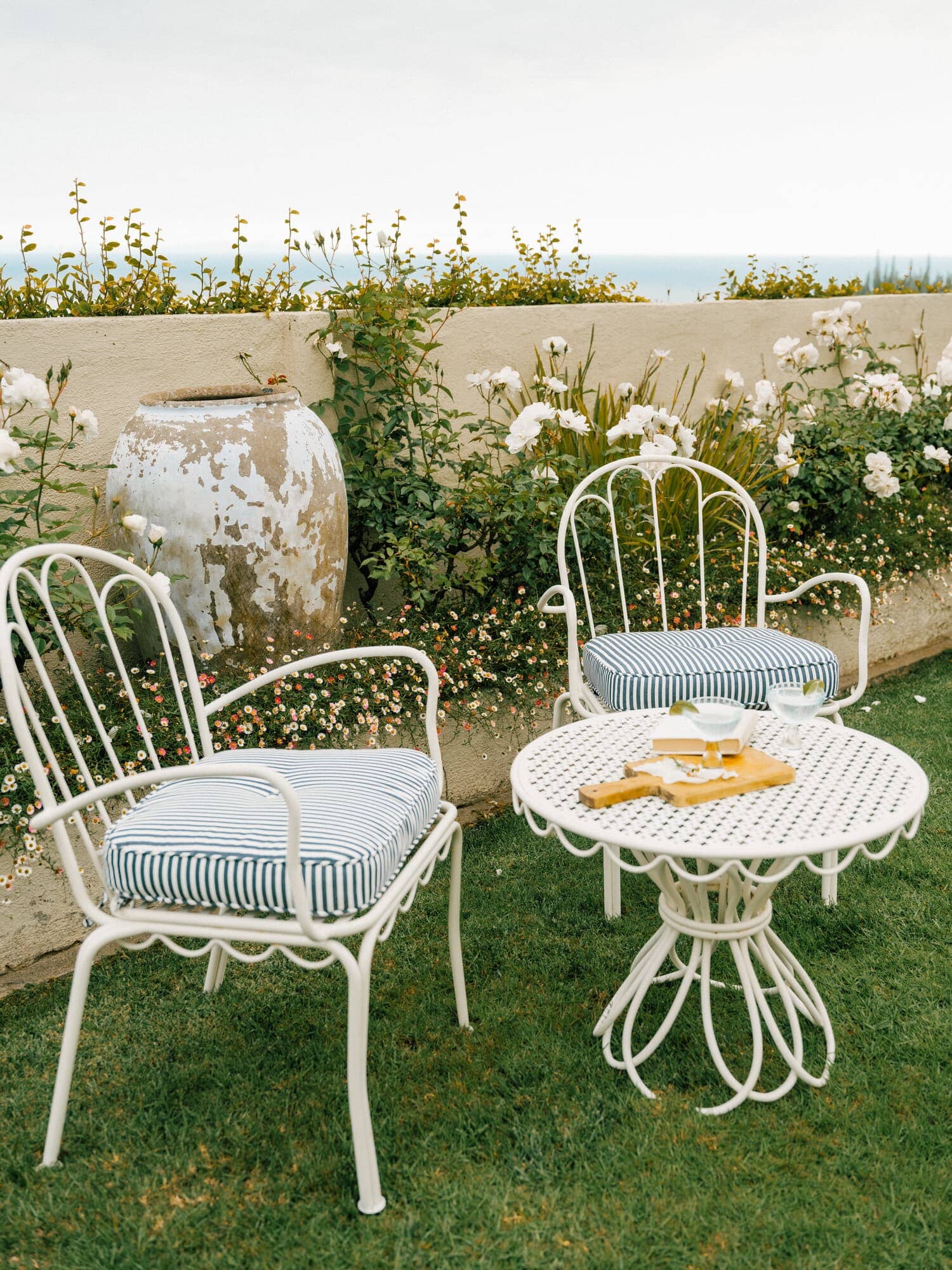 Navy al fresco chairs in a garden