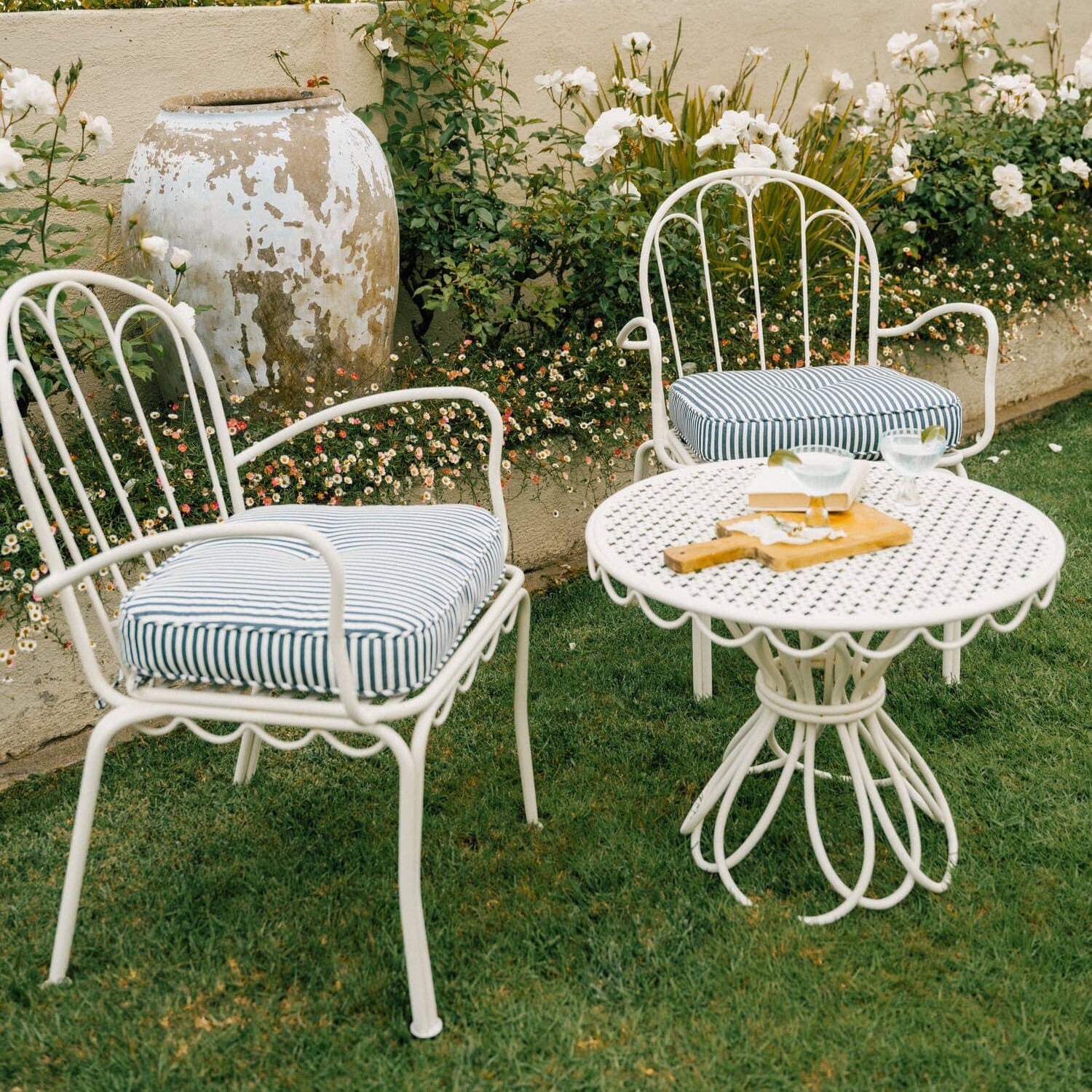 Navy al fresco chairs in a garden
