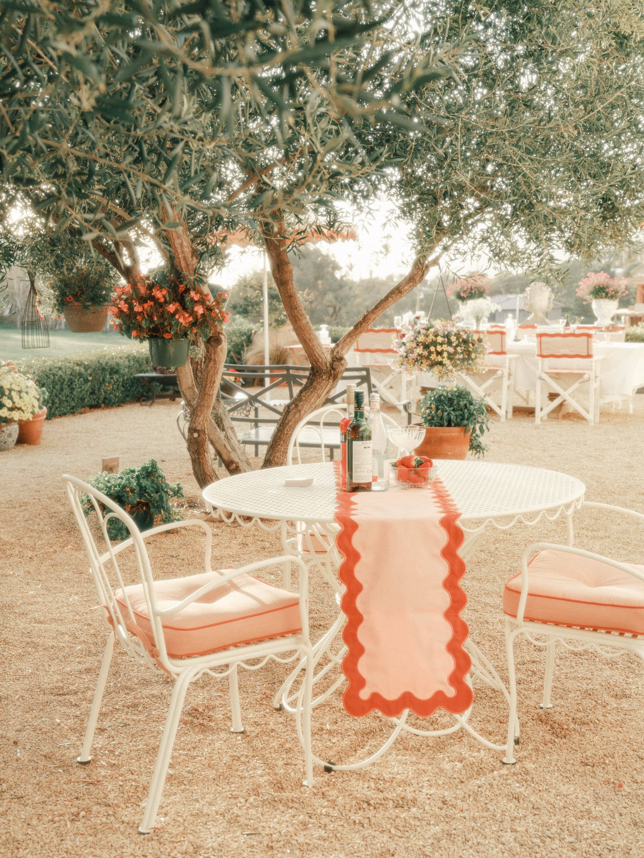 al fresco dining table with riviera pink chairs