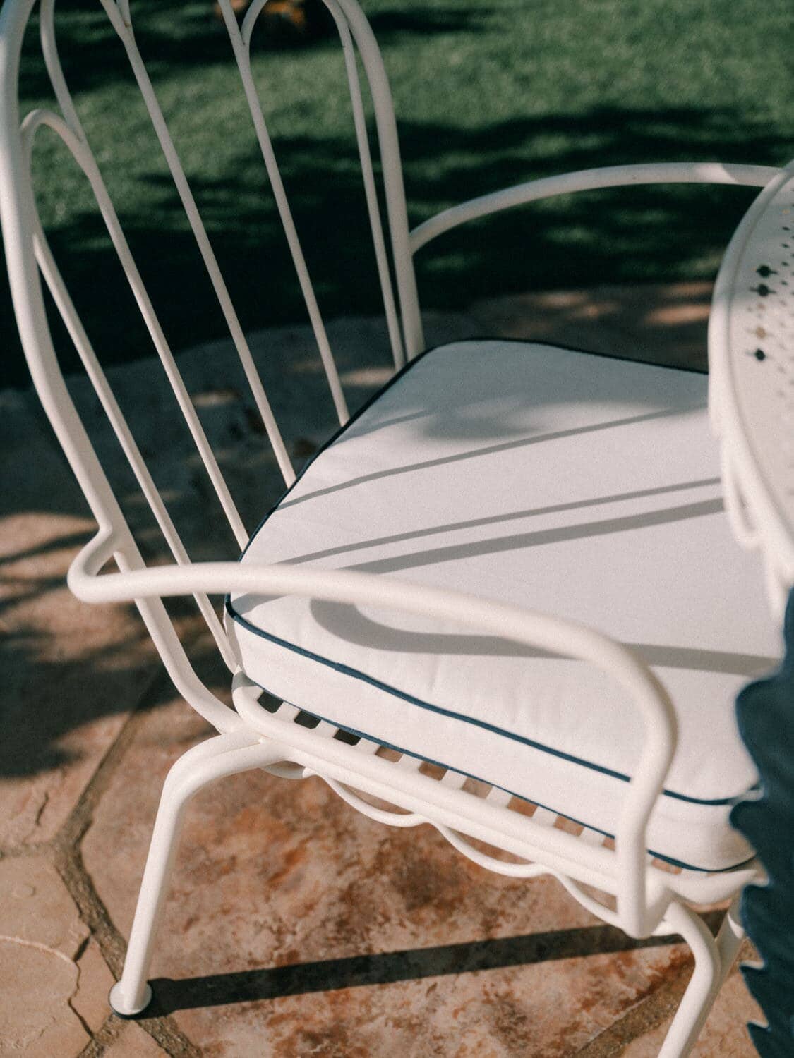 White seat cushion on a seat in the garden