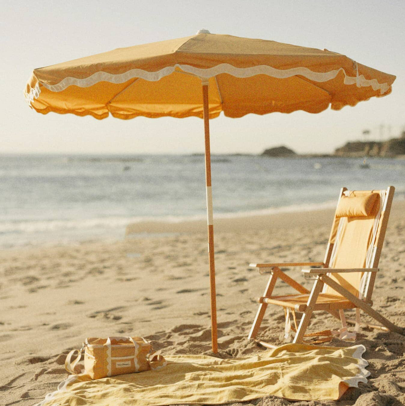 Riviera mimosa beach set up with umbrella, chair, blanket and cooler