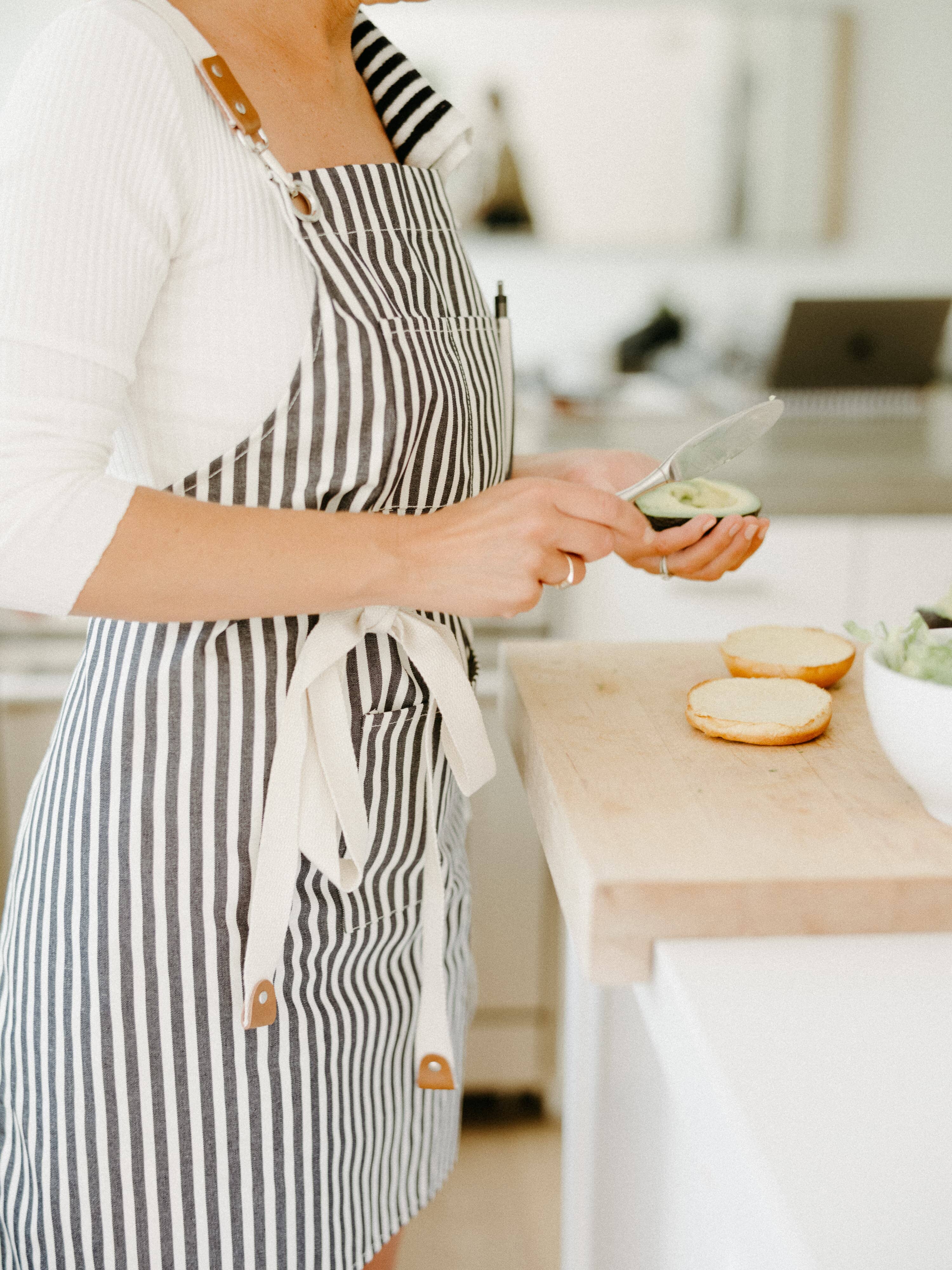 chef in the kitchen wearing navy apron