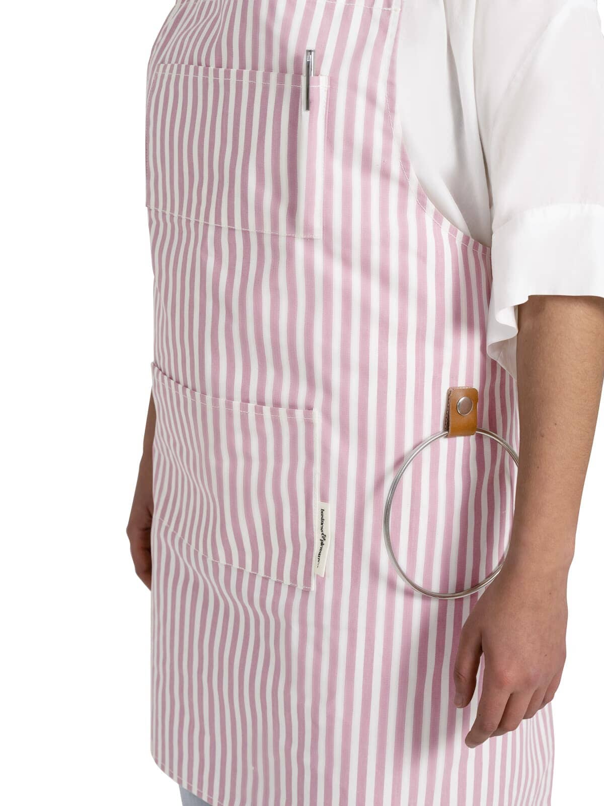 Studio image of pink apron on model