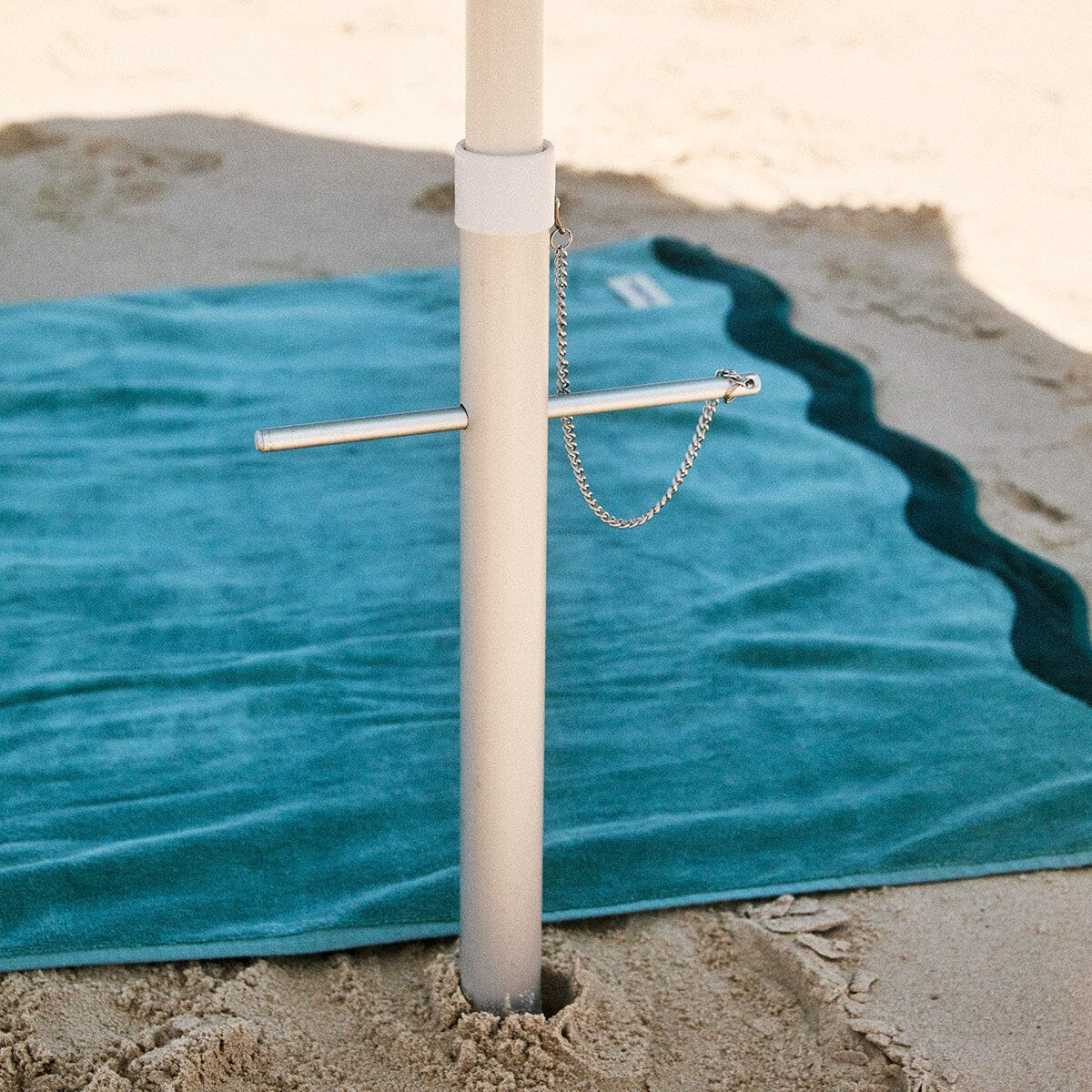 Umbrella sand screw in the sand