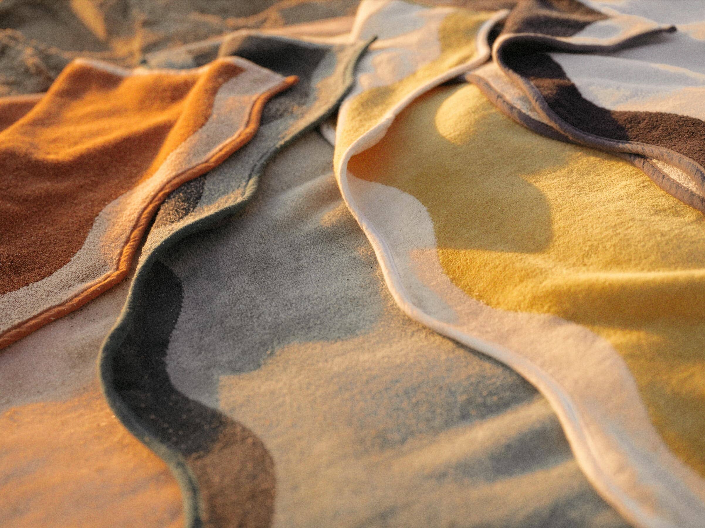 All 4 riviera beach towels on the sand