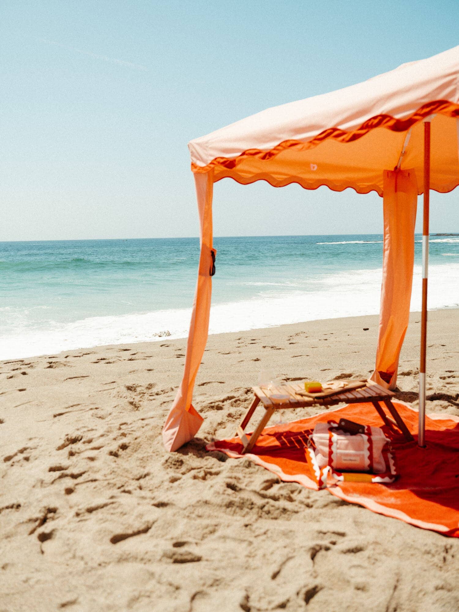 Riviera pink cabana with matching accessories on the beach