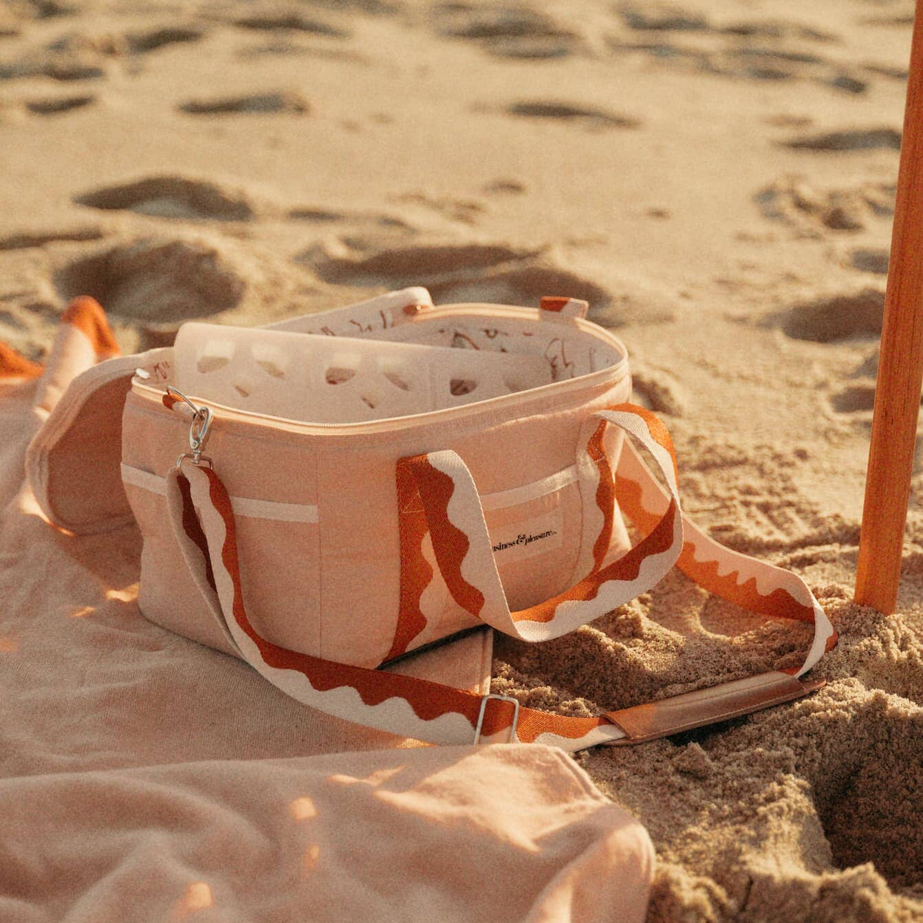 beach setting with riviera pink cooler bag