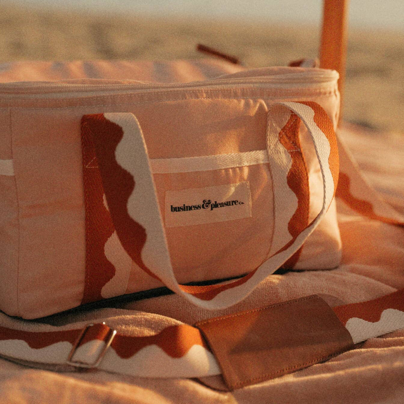beach setting with riviera pink cooler bag