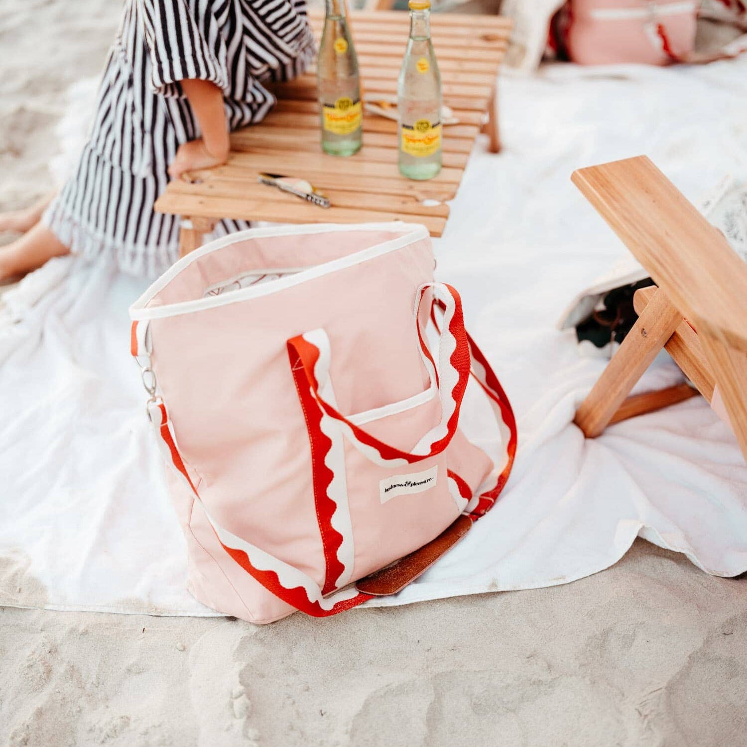 Rivie pink cooler tote with a picnic set up