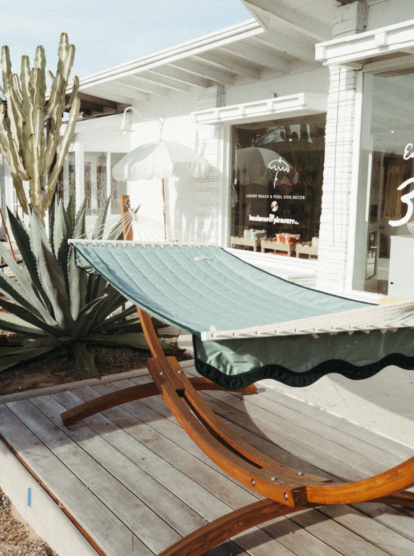riviera green hammock on a patio