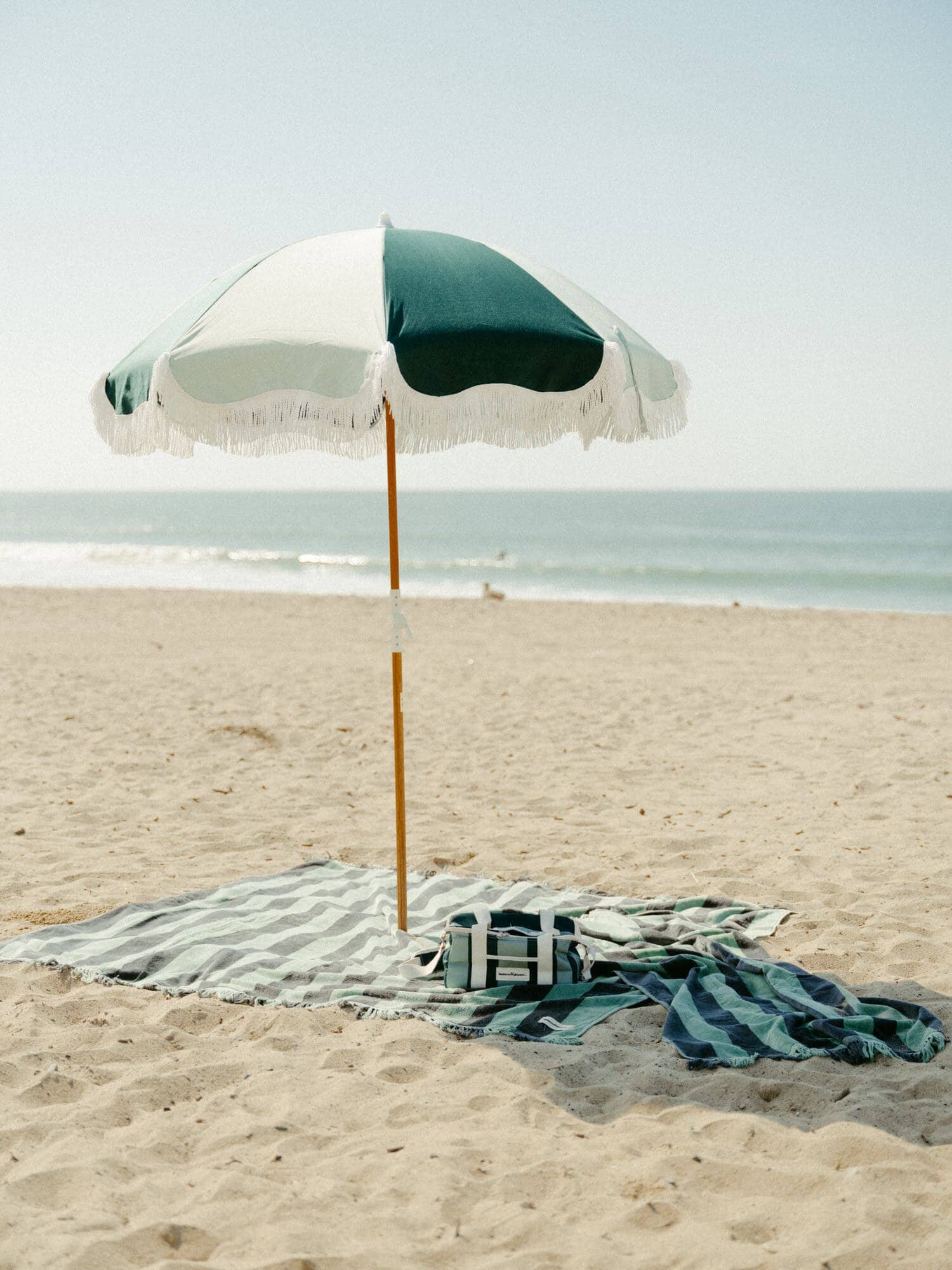 70s panel green umbrella on the beach with accessories