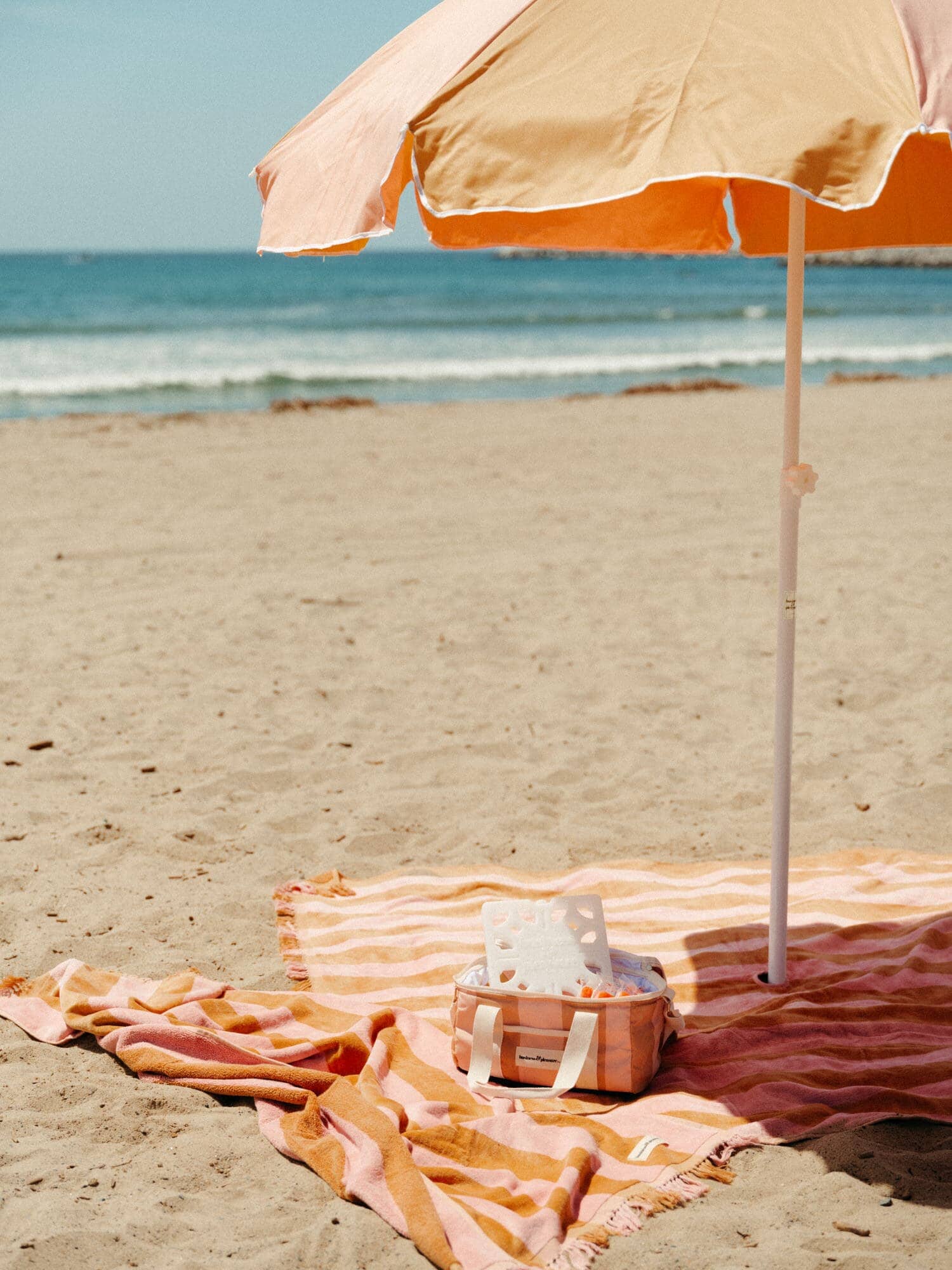 70s panel sand blanket, towel and cooler on the beach