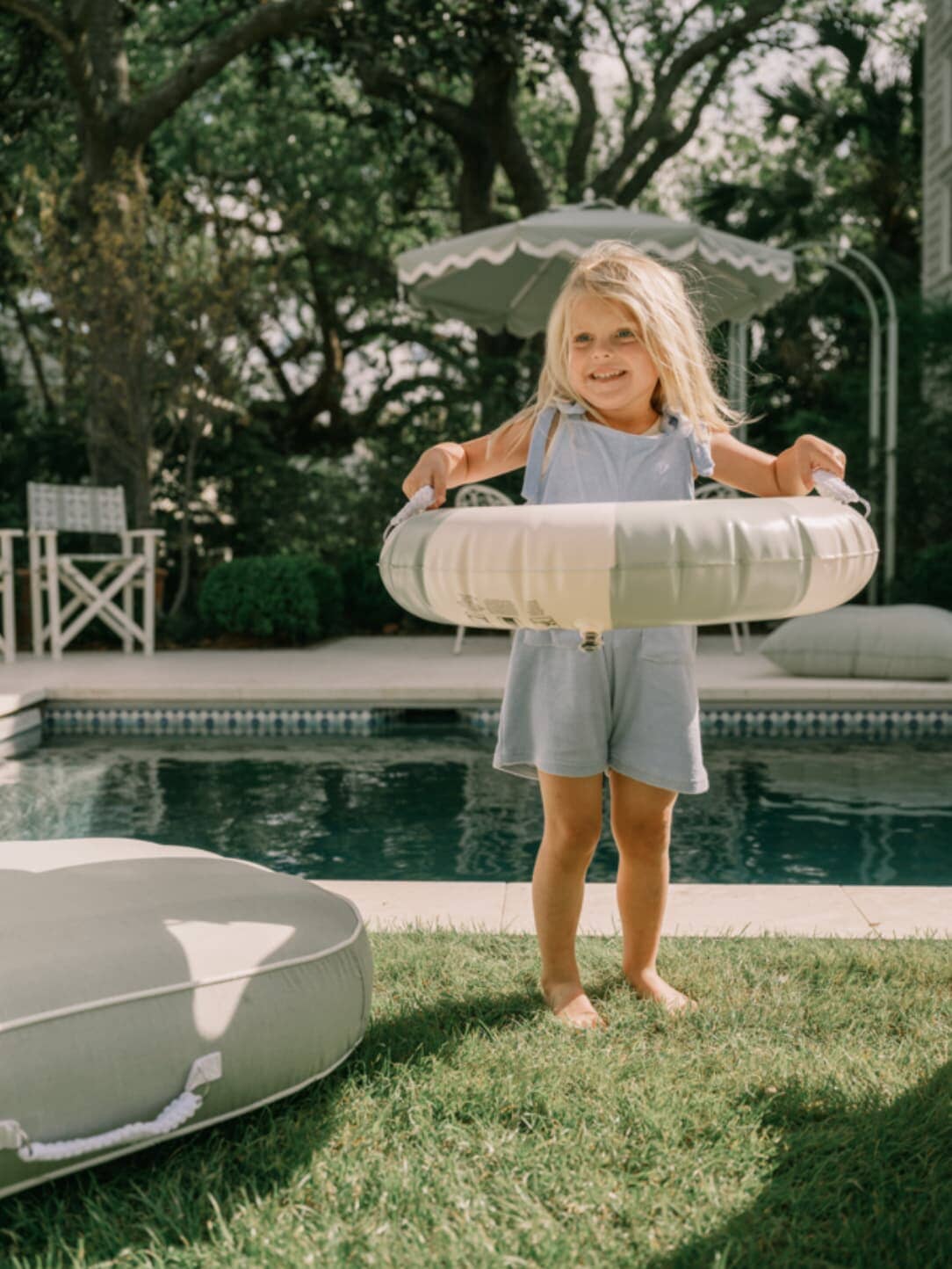 Little girl with a pool ring