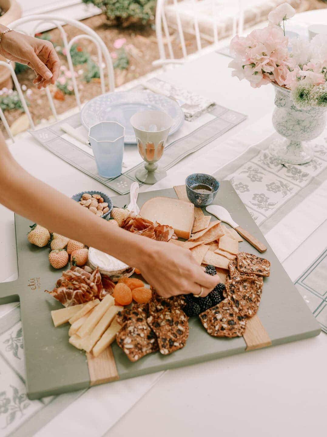 Charcuterie board on an outdoor table