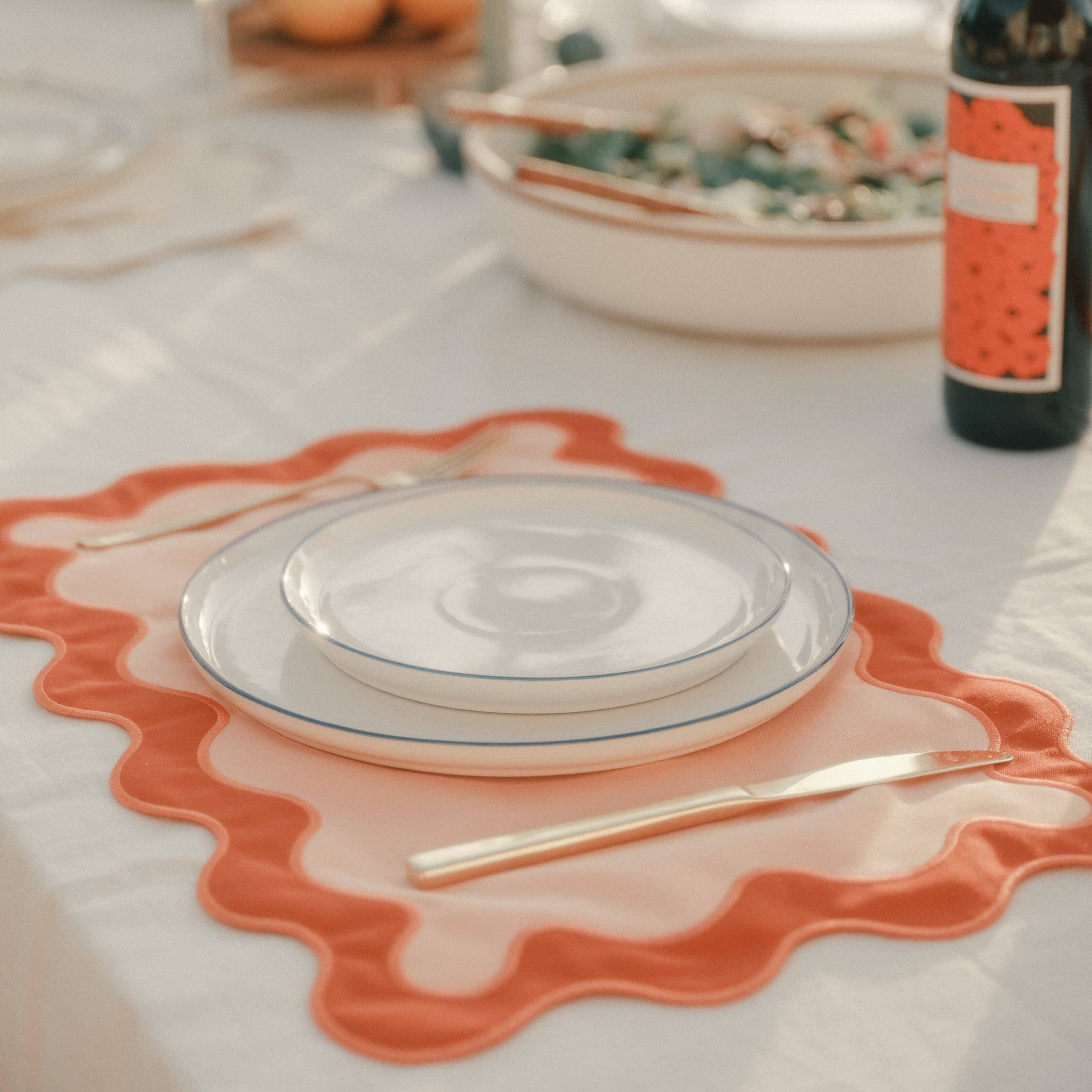 table setting with table cloth and placemat