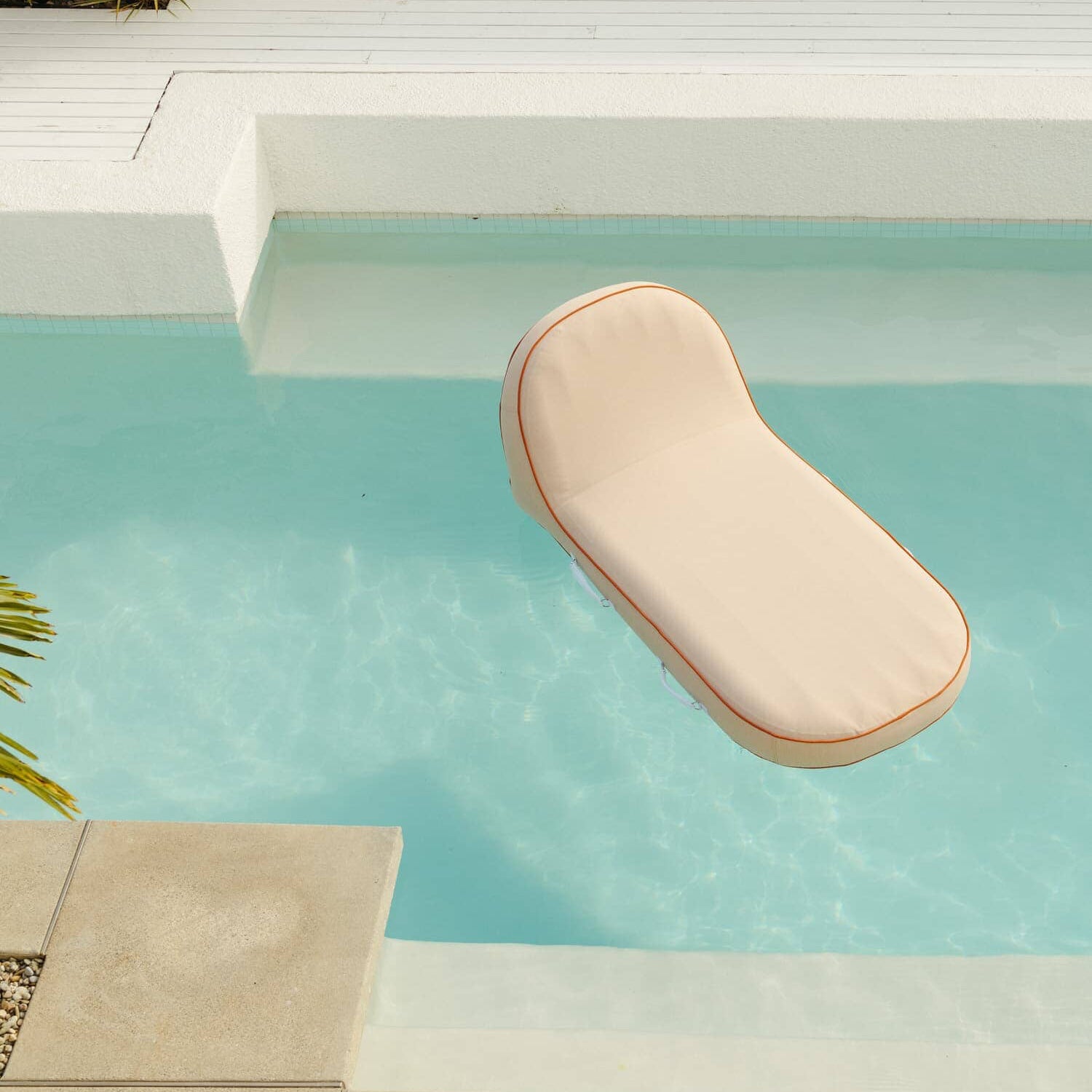 Riviera pink pool lounger in the pool