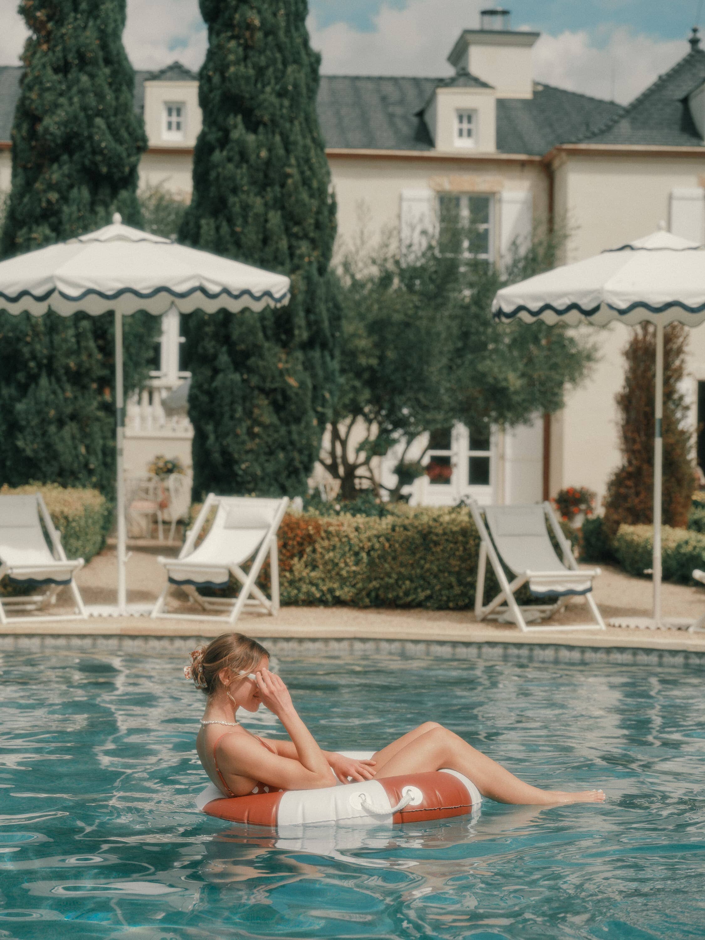 girl floating on a pool ring