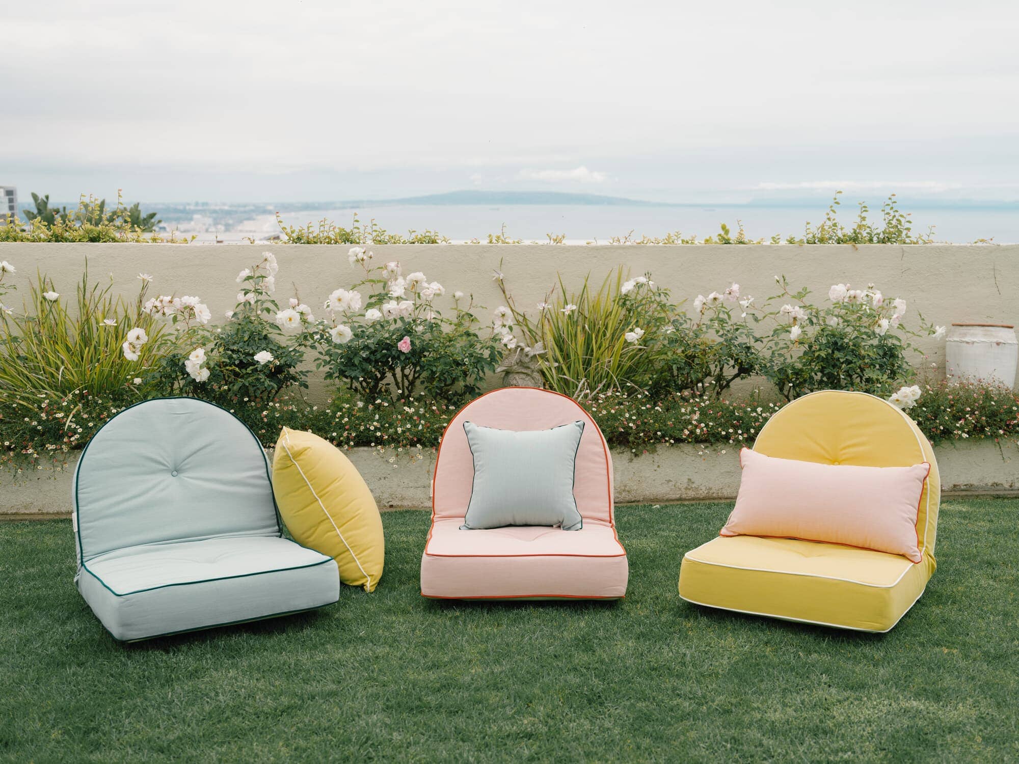 Reclining pillow loungers in a garden setting