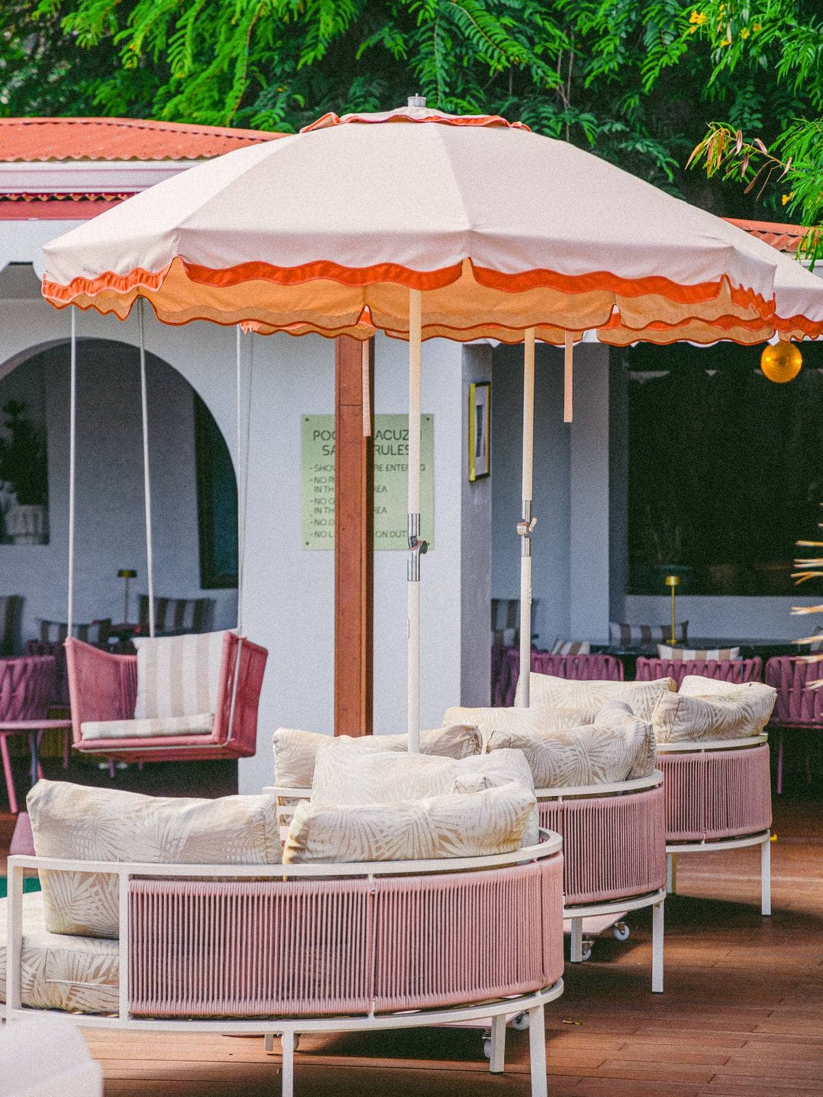 Beach club umbrellas in a coastal beach club setting