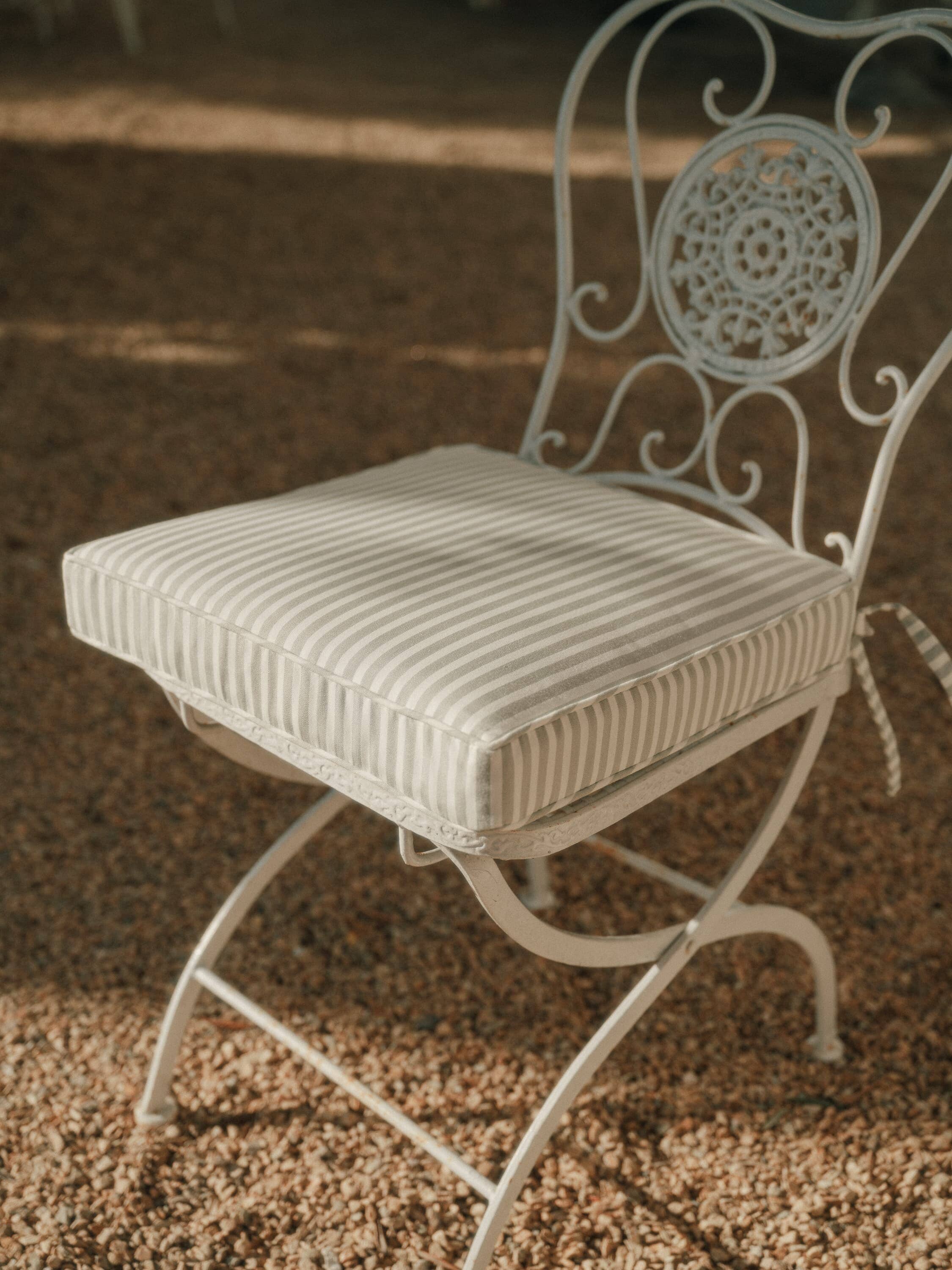 sage seat pillow on metal frame chair