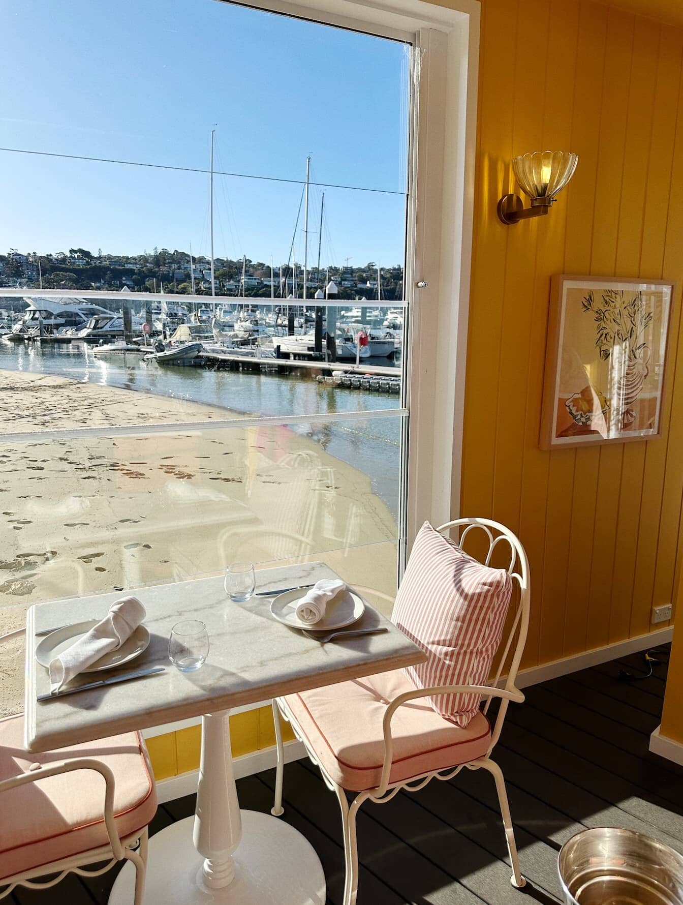 Al fresco chair in a restaurant with cushion and small square cushion