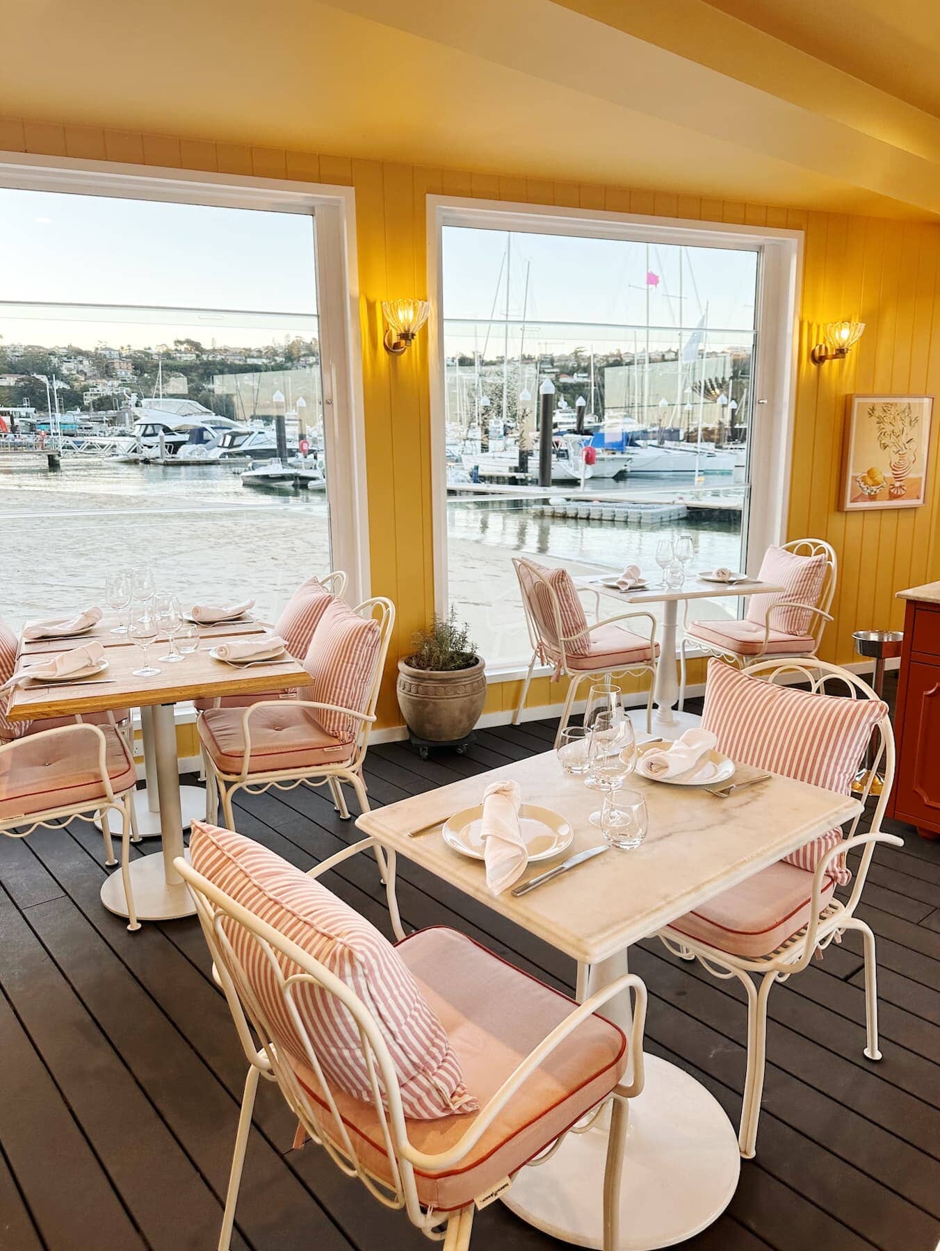 Al fresco chair in a restaurant with cushion and small square cushion