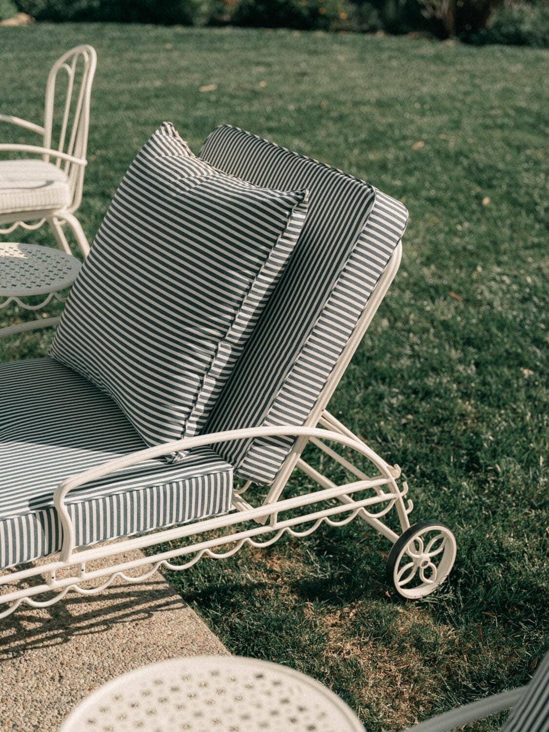 Navy sun lounger on grass