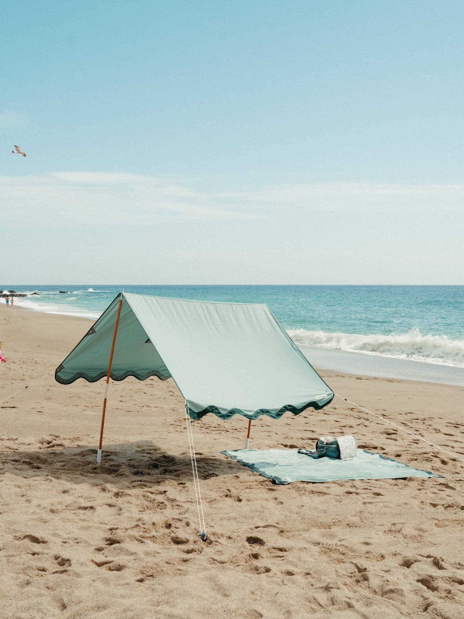 Riviera green tent with matching accessories on the beach
