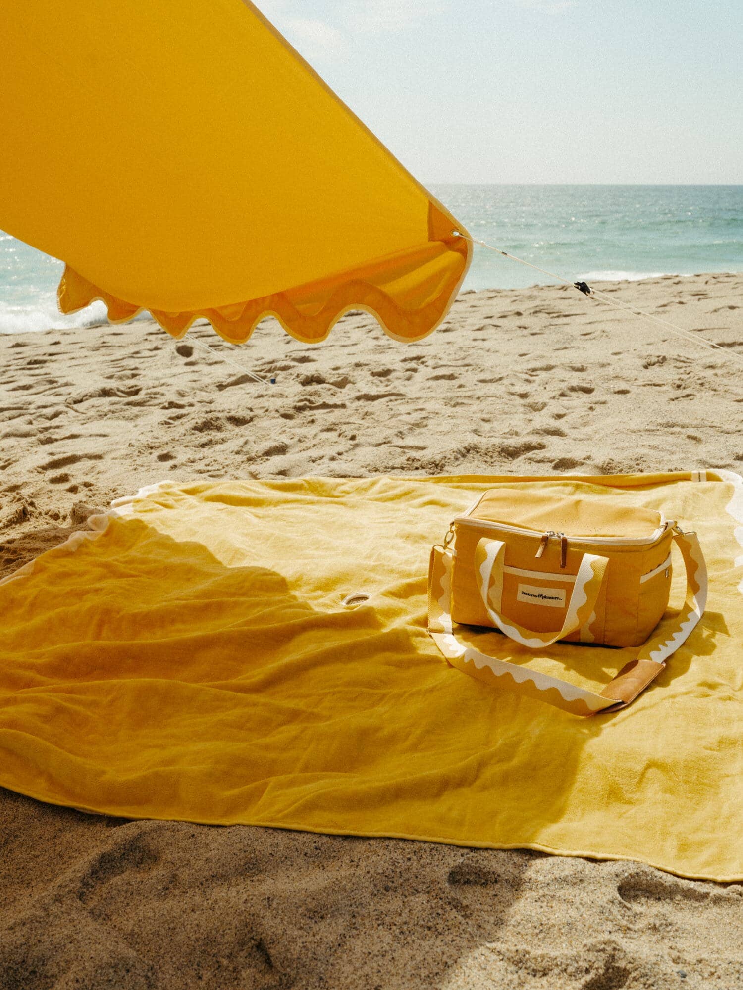 Riviera mimosa tent on the beach with matching accessories
