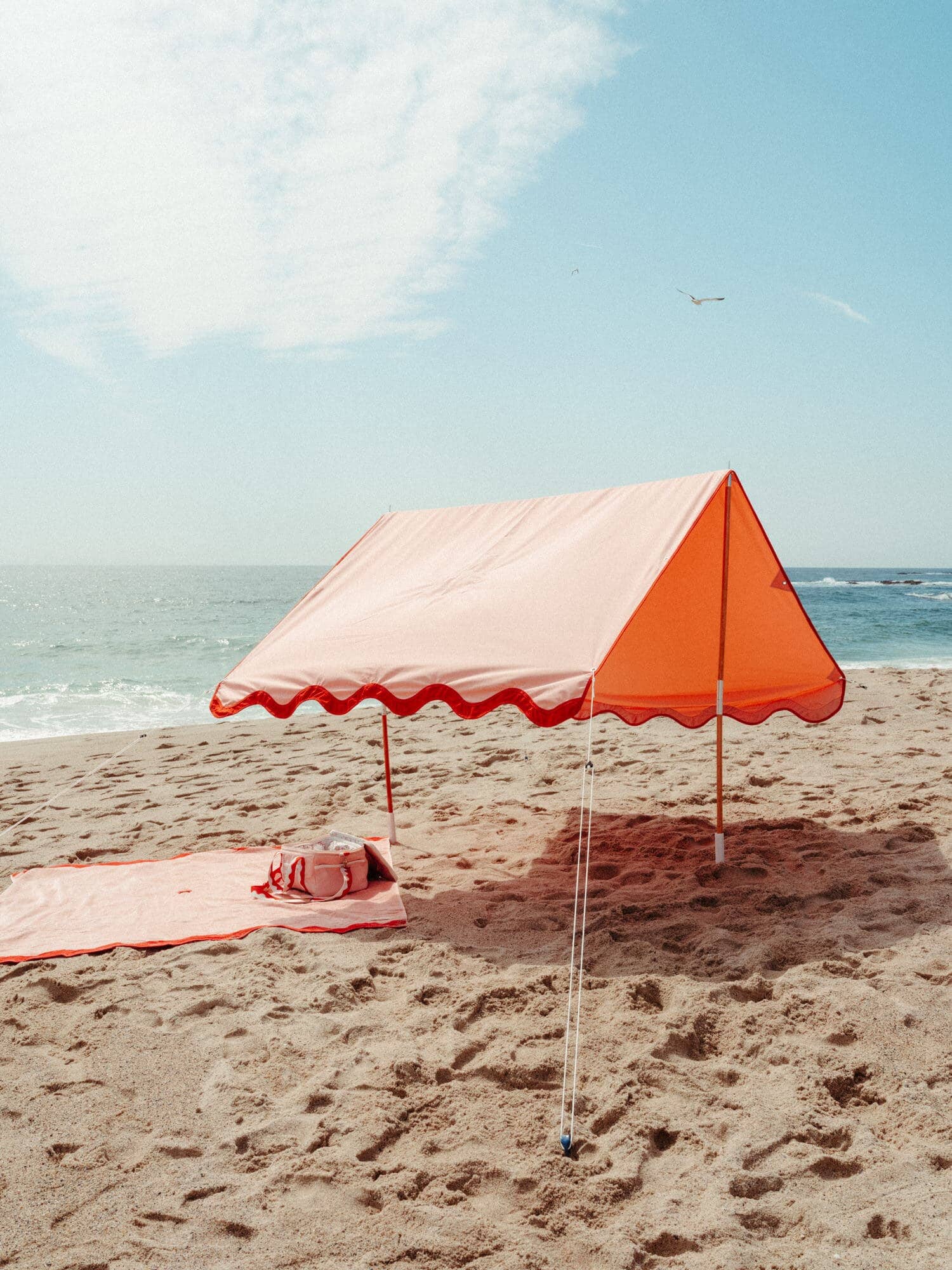 Riviera pink beach tent with matching accessories on the beach