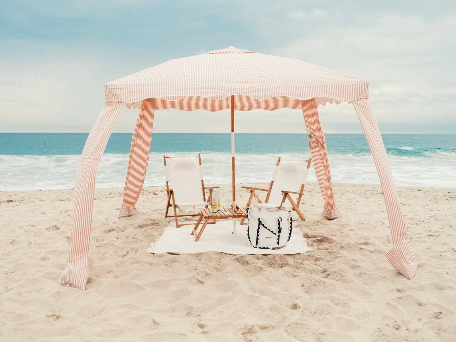 Beach set up with cabana, chairs and accessories