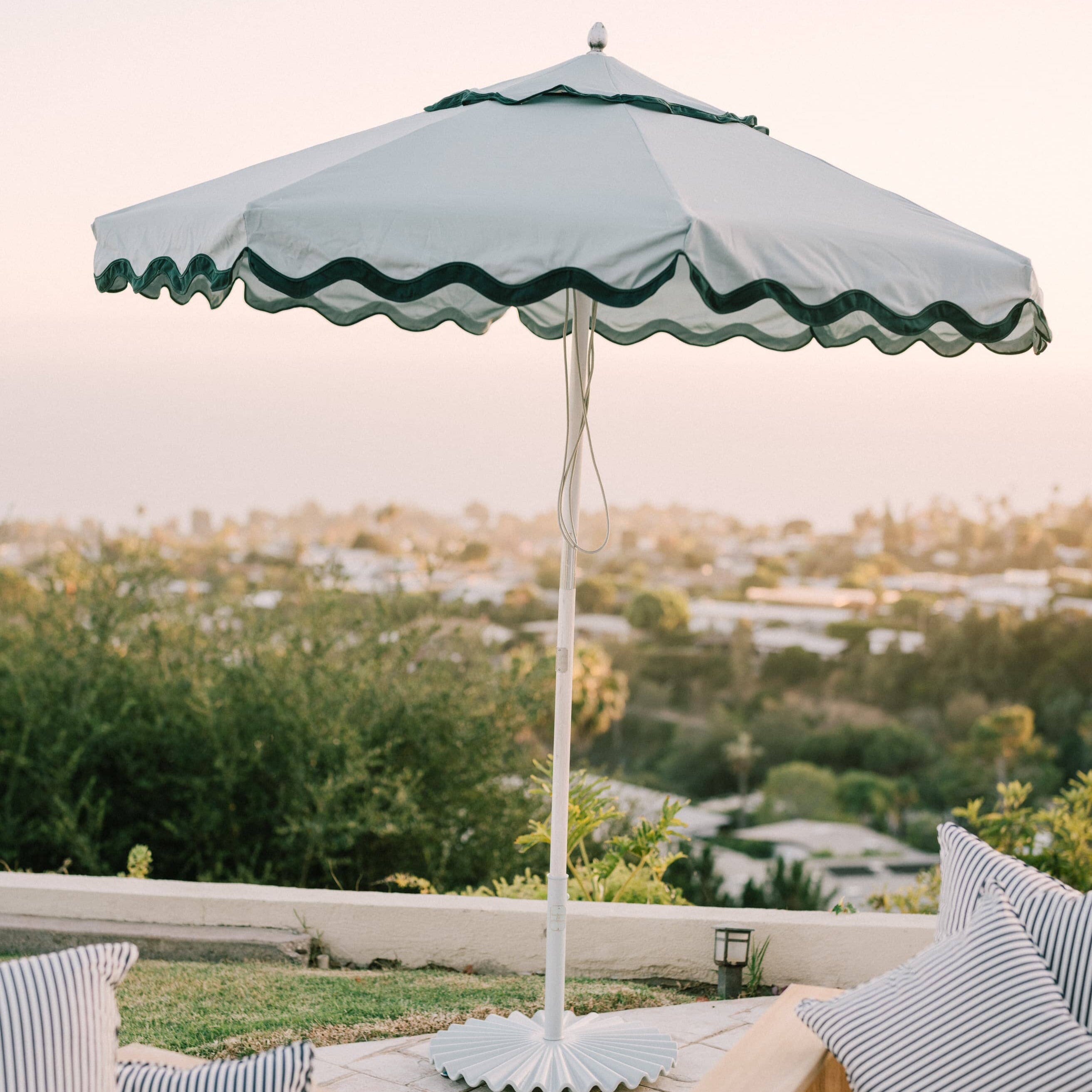 Riviera Green Market Umbrella on a patio
