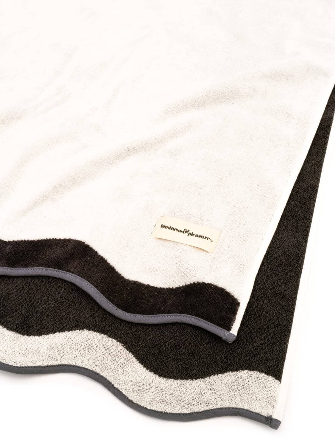studio image of white riviera beach towel