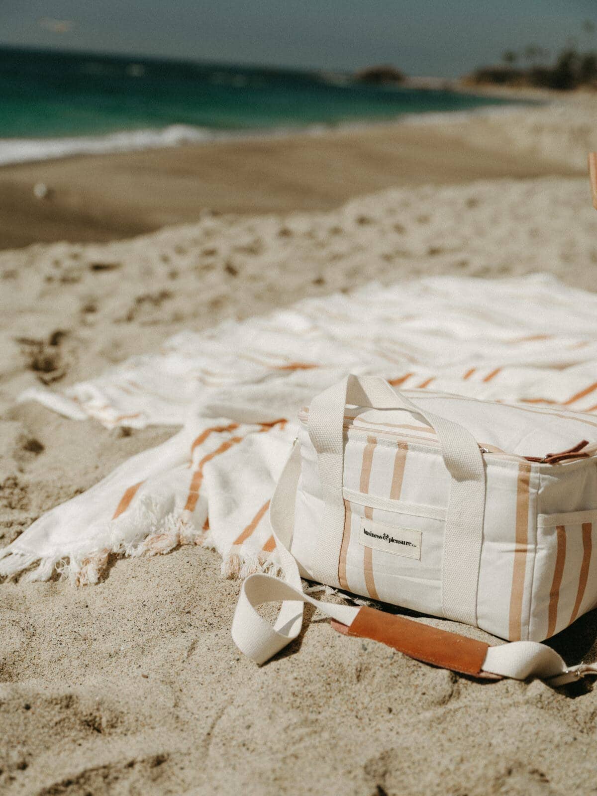 Sand stripe cooler bag on the beach