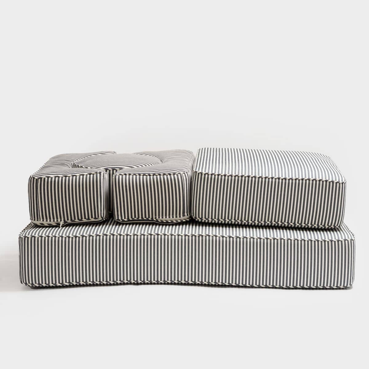 Studio image of the side view of the stacked modular pillow stack