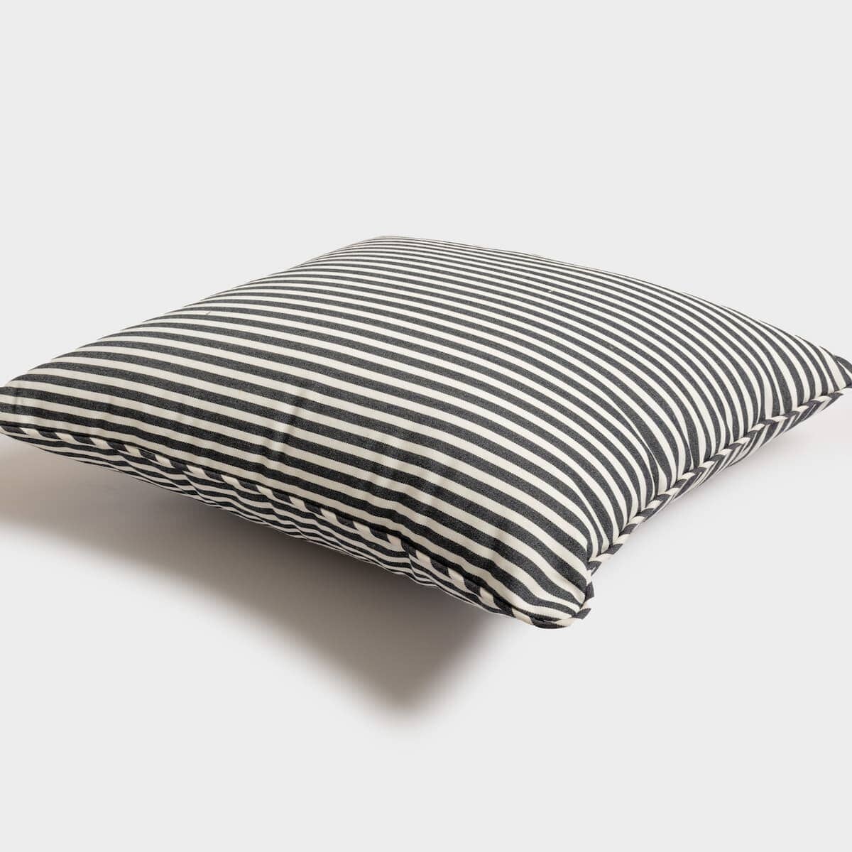 studio image of small square throw pillow
