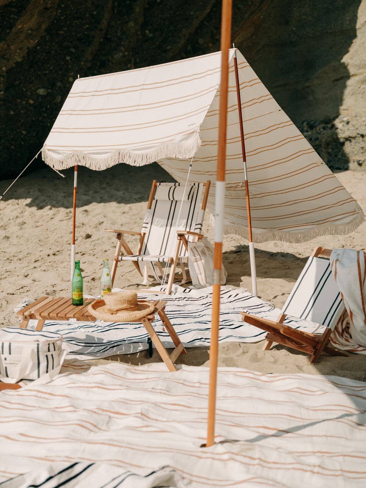 Black and sand two stripe products at the beach