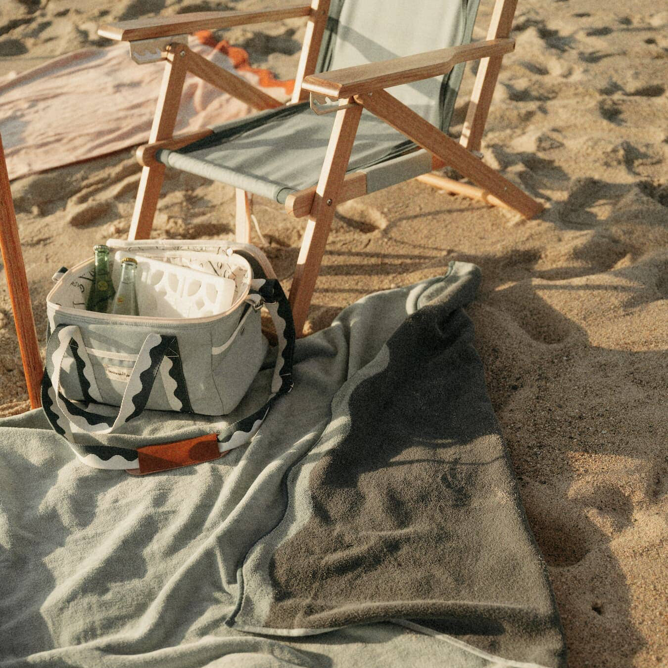 Beach set up with Riviera green umbrella, chair, towel & cooler