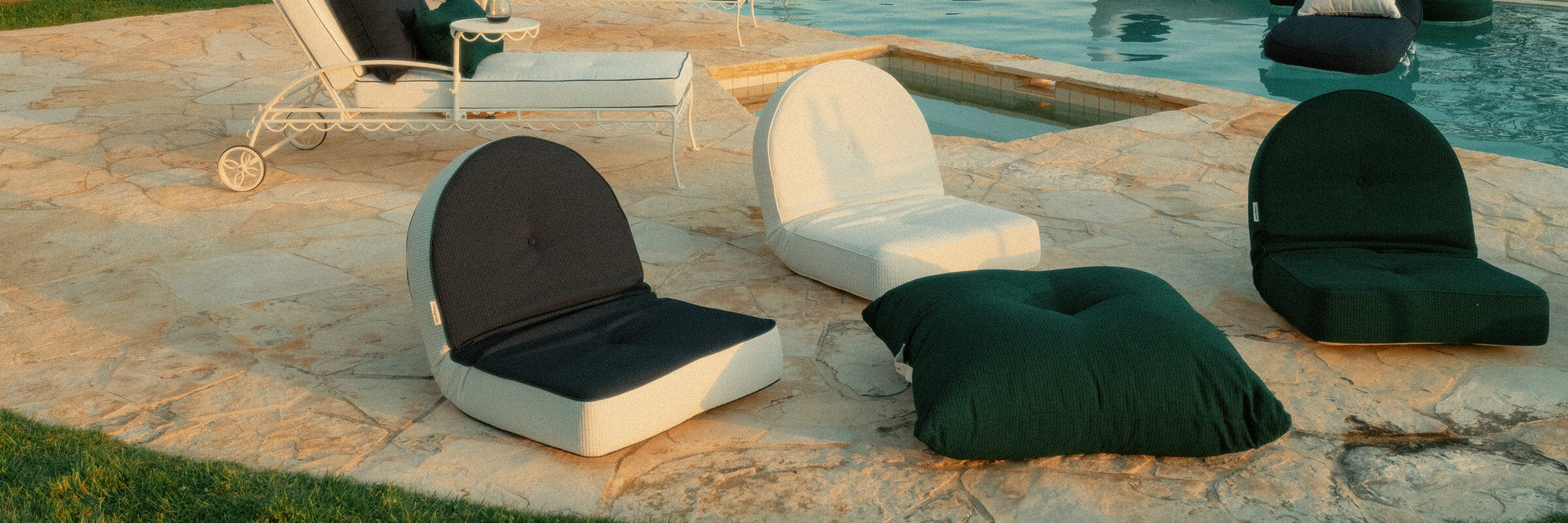 Brightly colored outdoor pillows on a lawn