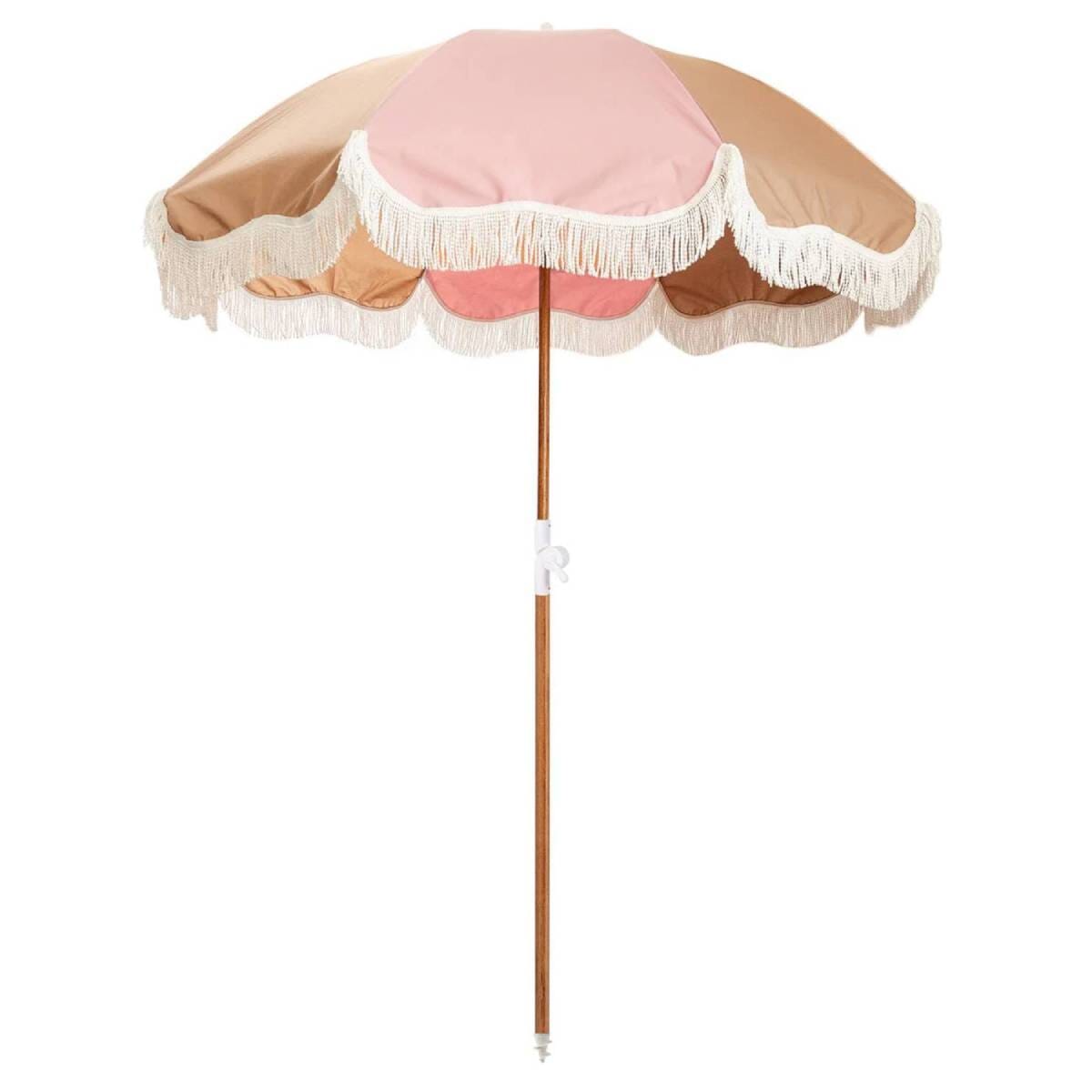 studio image of 70s sand holiday beach umbrellas